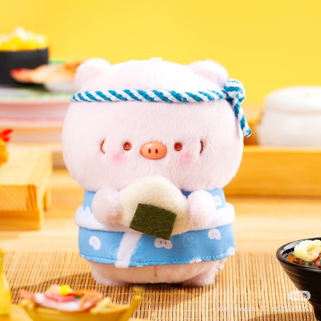 Timbo- Izakaya Series Plush Pendant Blind Box featuring a pig plushie in a kimono with onigiri, surrounded by Japanese-style dishes on a bamboo mat.