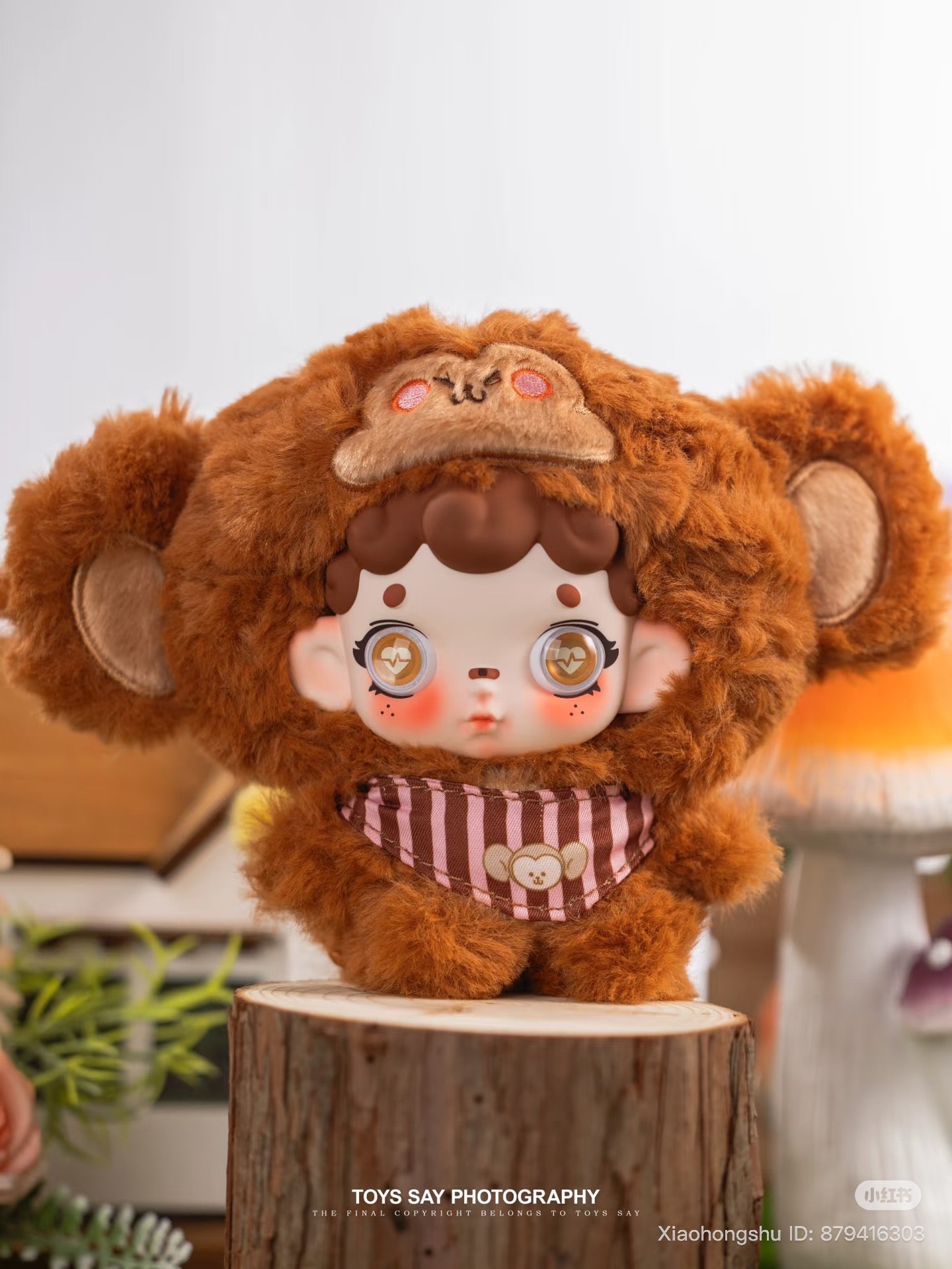 Wonderfull ruri Animal Stealth Operation Series plush pendant in a monkey costume, posed on a log pedestal, available for preorder at Strangecat Toys.
