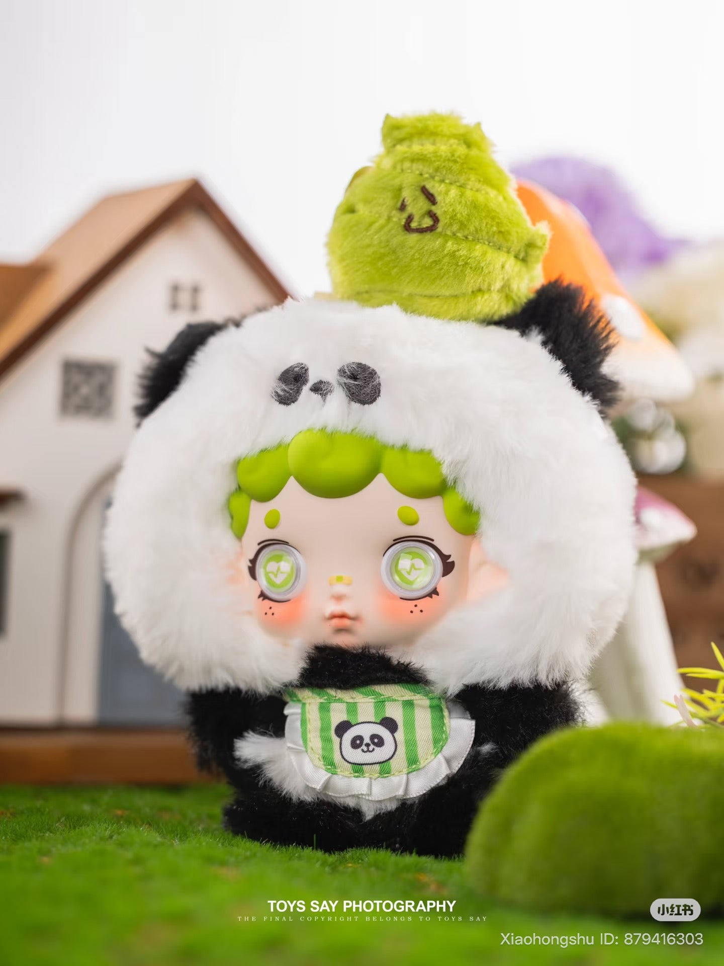 Wonderfull ruri Animal Stealth Operation Series collectible doll in a panda costume, featuring a green-haired figure with heart-motif eyes, on artificial grass setting.