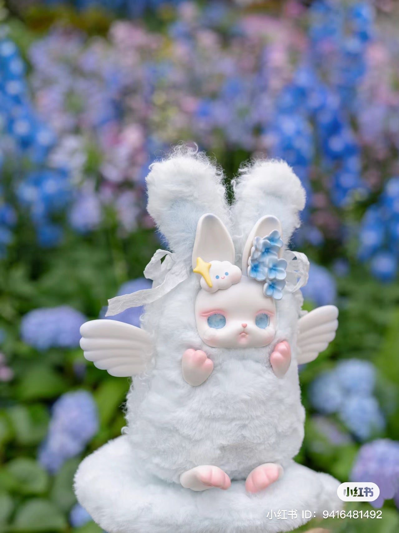 A white stuffed animal with bunny features and wings, part of the Loloan- Confession Language Blind Box Series at Strangecat Toys.