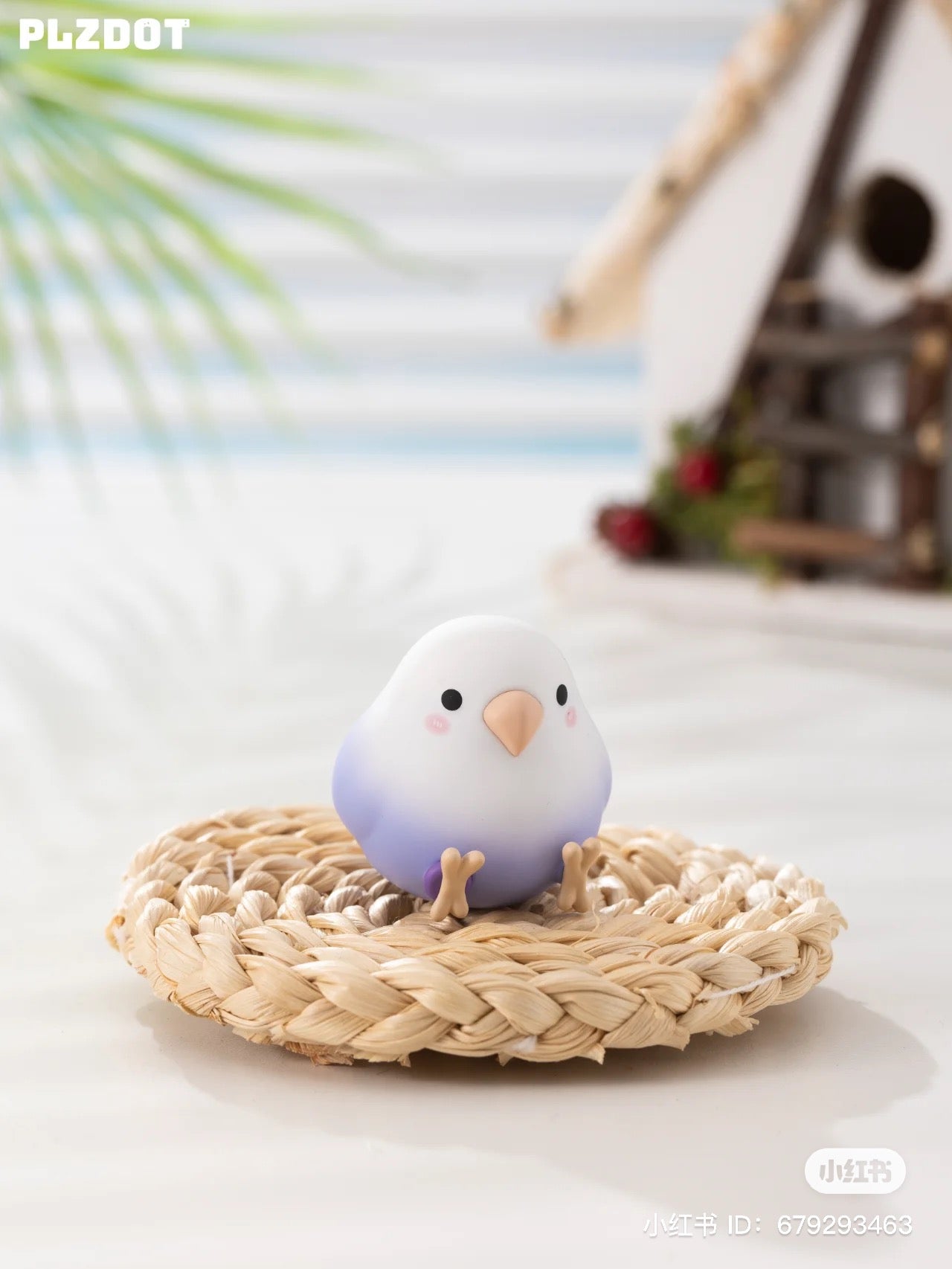 A blind box series featuring Love Bird Mini toys on a straw surface, a toy bone, and a birdhouse. Preorder now from Strangecat Toys for a surprise design in each box.