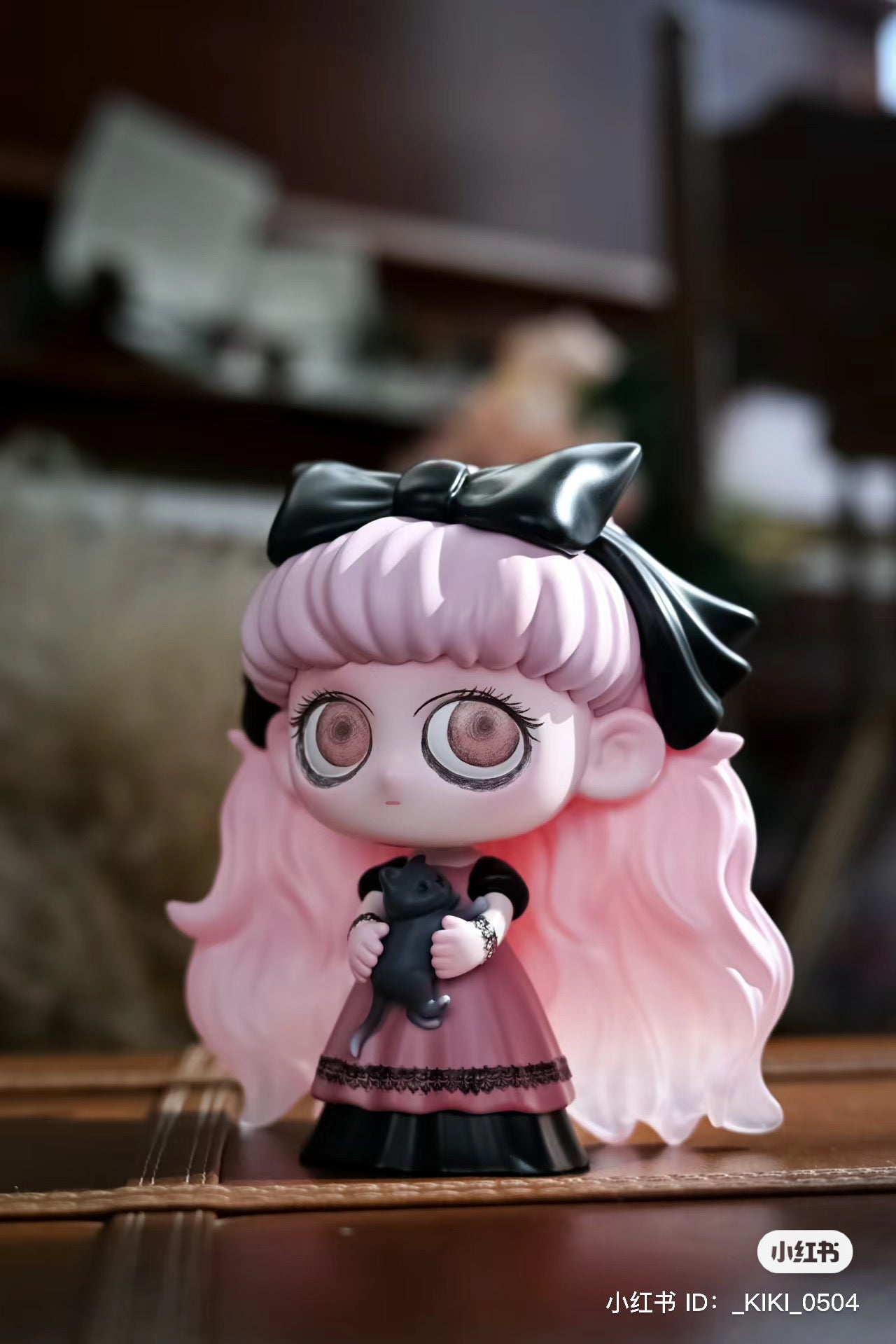 A toy figurine of Kiki Cat Witch, a girl holding a cat, in resin/PVC, 11cm. From Strangecat Toys, a blind box and art toy store.