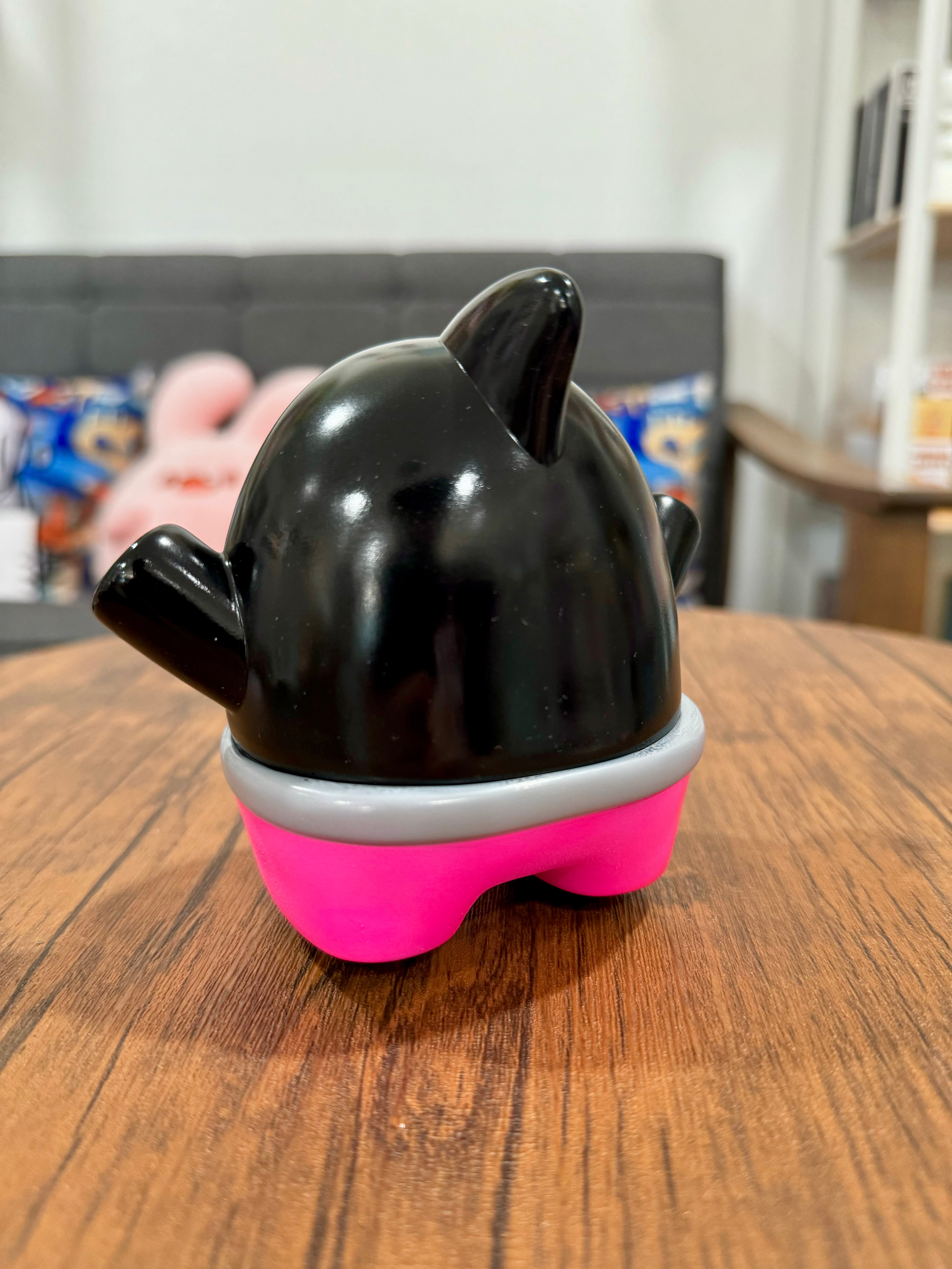 A blind box and art toy store. Sofubi figure SHARK BlaPi by CO2, 11.5cm. Indoor teapot on table. Ceramic kettle with lid.