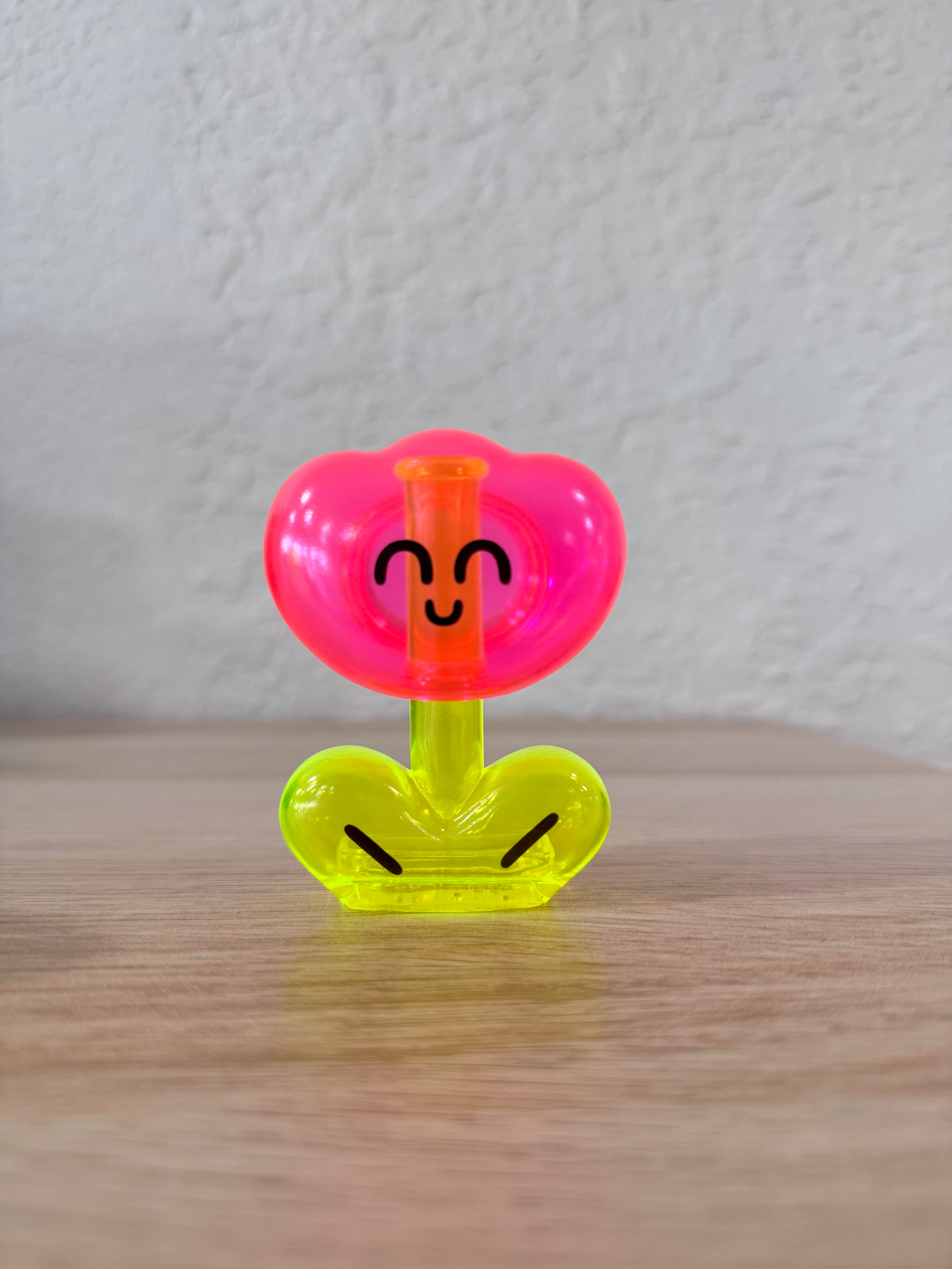 Rodriguez Neon Pink by OHIGE no PON, a Japanese sofubi toy, features a playful face design. Measures 10-15cm.