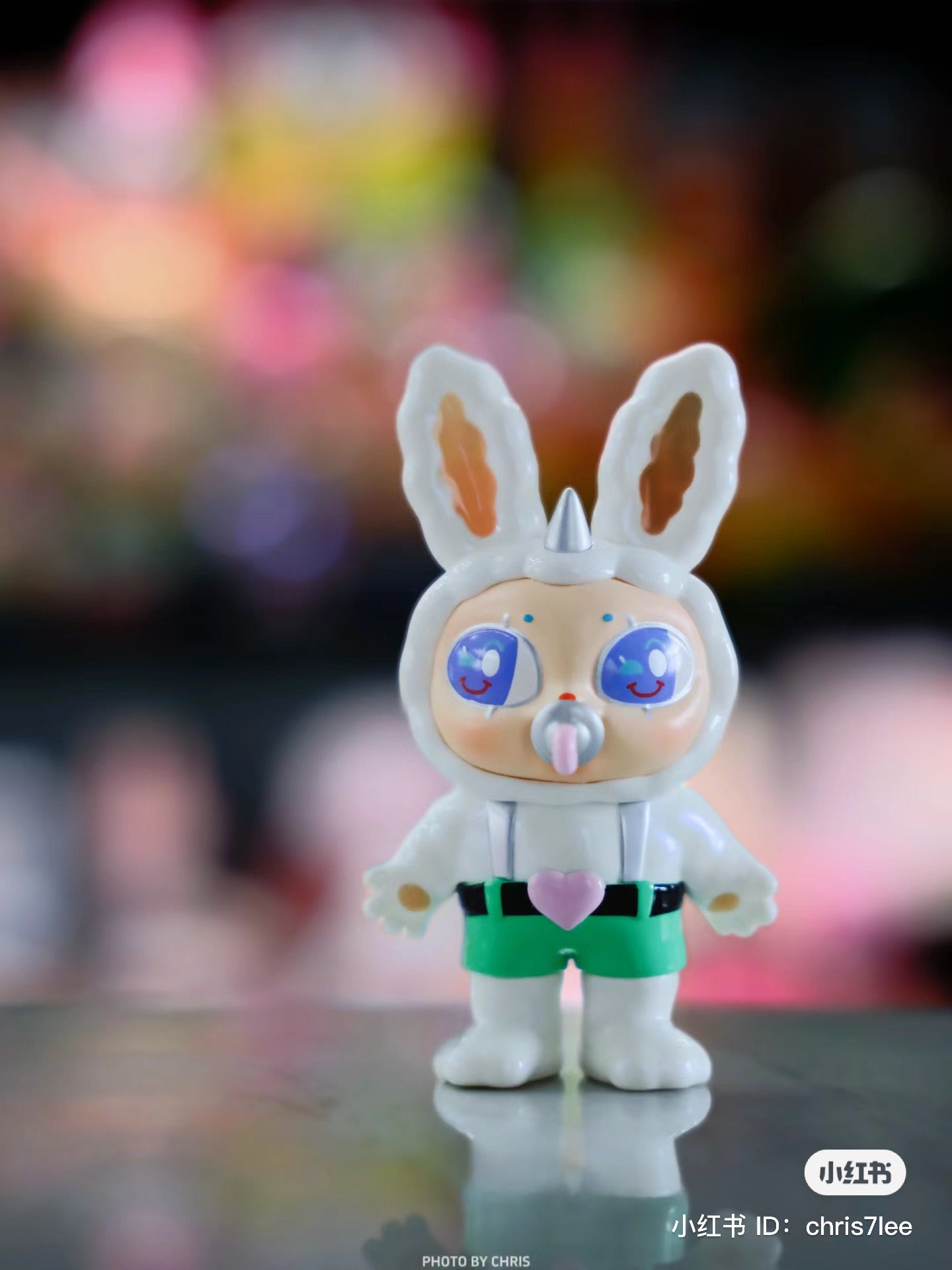 Toy figurine of a bunny in a garment, titled Agan Agan-65% bang bang bang, made from PVC, featuring white boots.