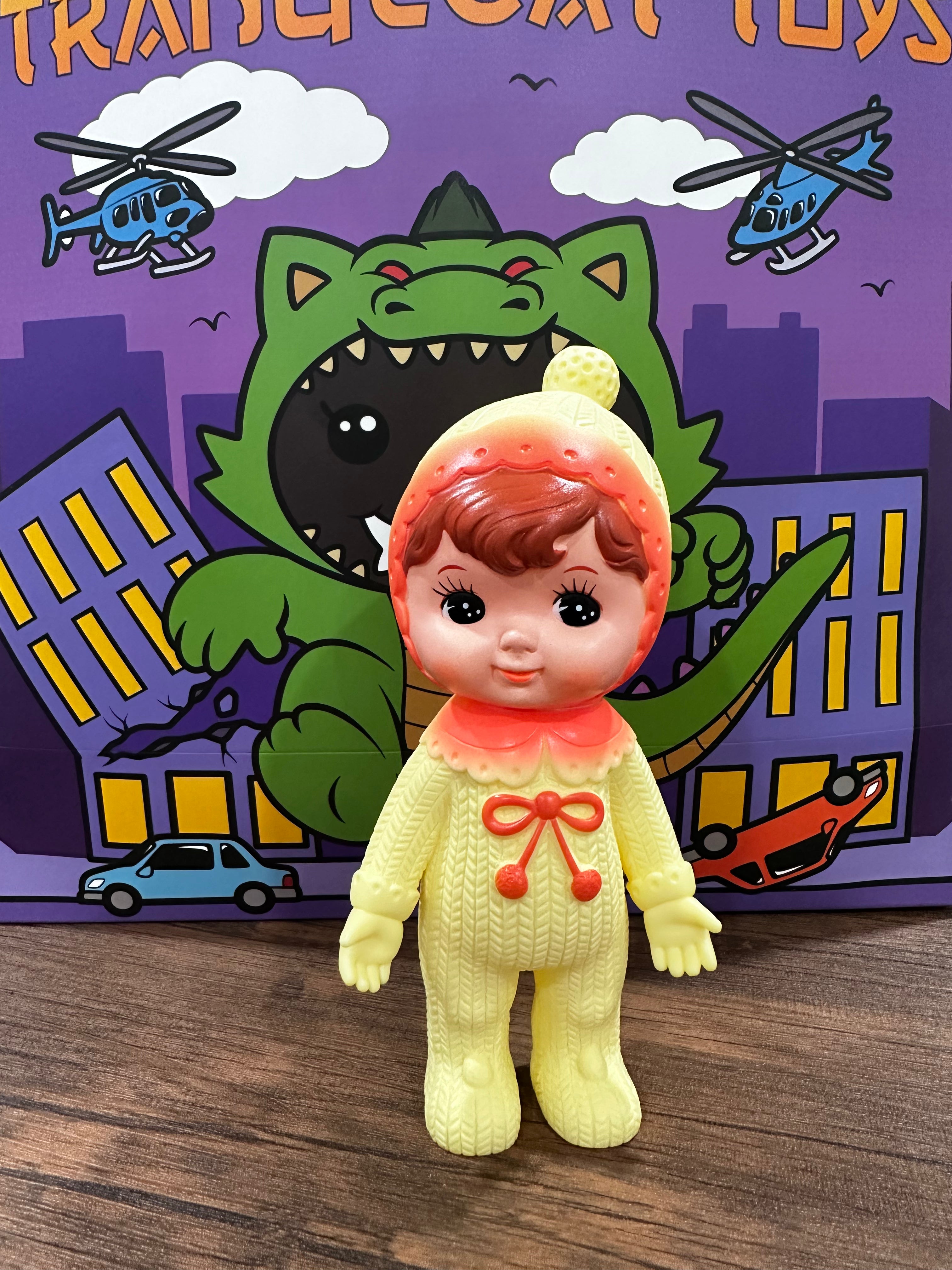 Kodama Toy Charmy chan - WD.LEM.1: A woodland doll with a toy doll in a sweater and a red bow, in front of a poster and a cartoon helicopter.