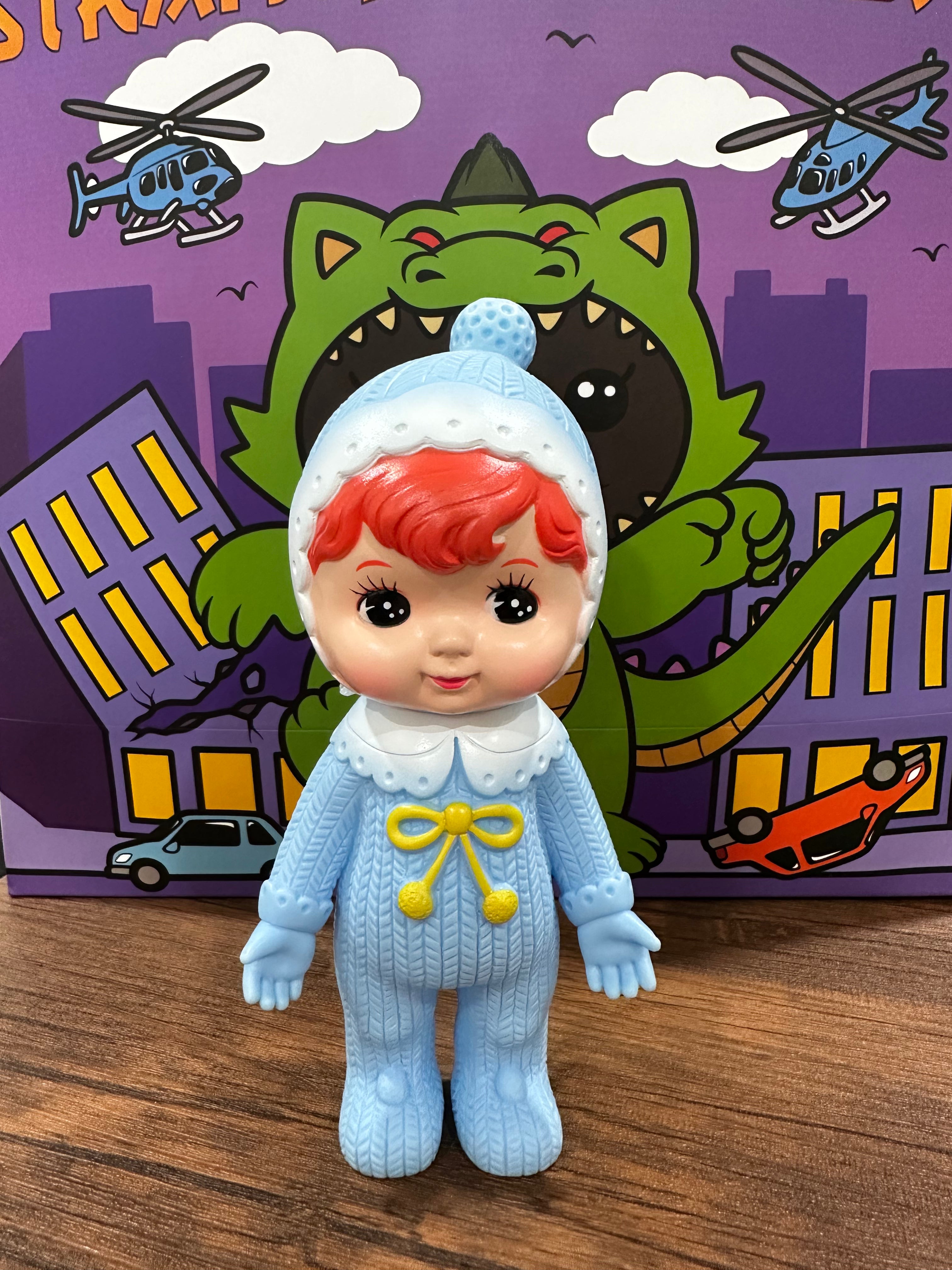 Kodama Toy Charmy chan doll in blue dress with yellow bow, animated cartoon helicopter nearby.