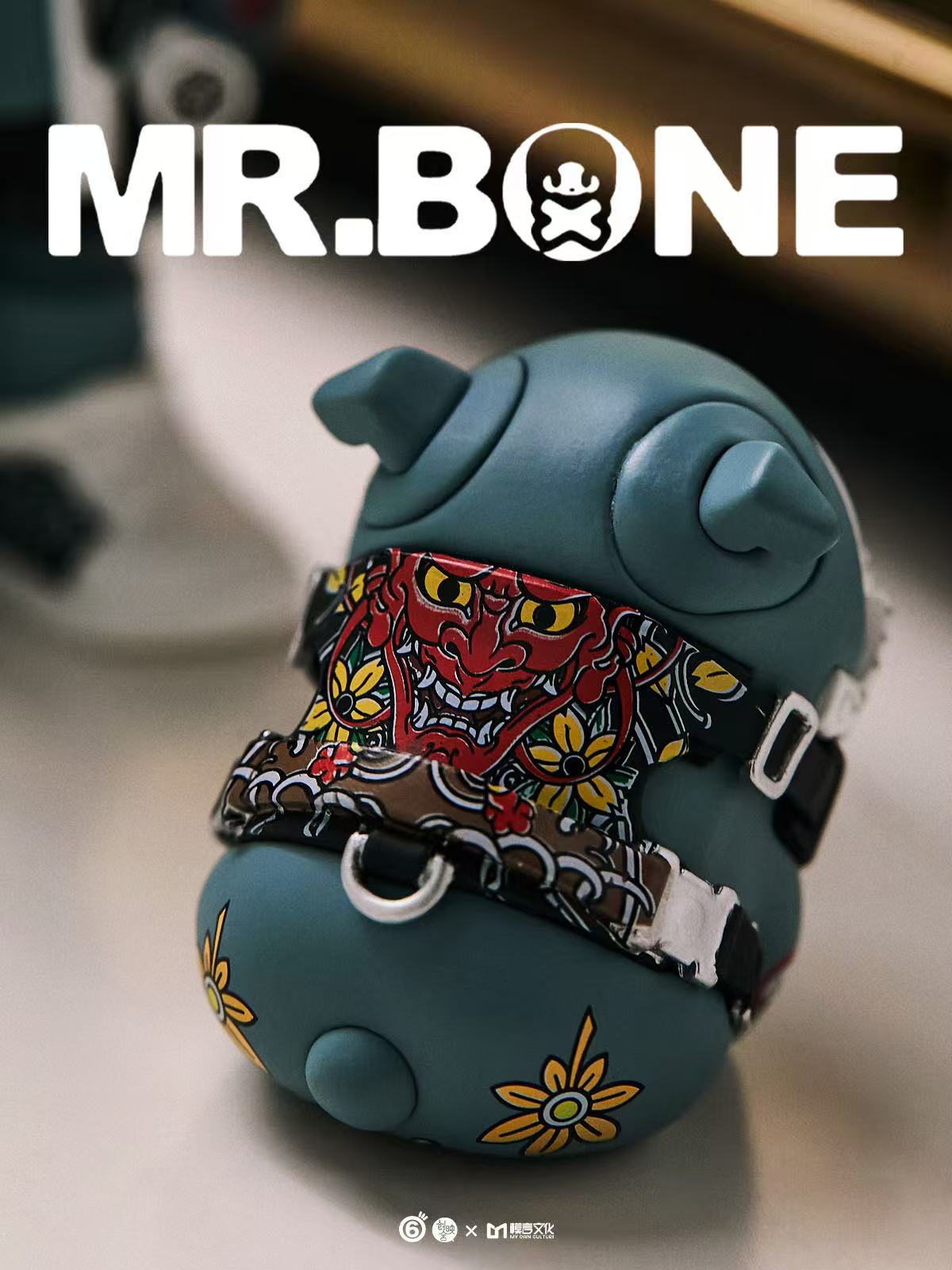 Mr Bone Yakuza Limited Set 100% collectible features a sculpted vinyl figure with a harness adorned with red oni masks, available for preorder.