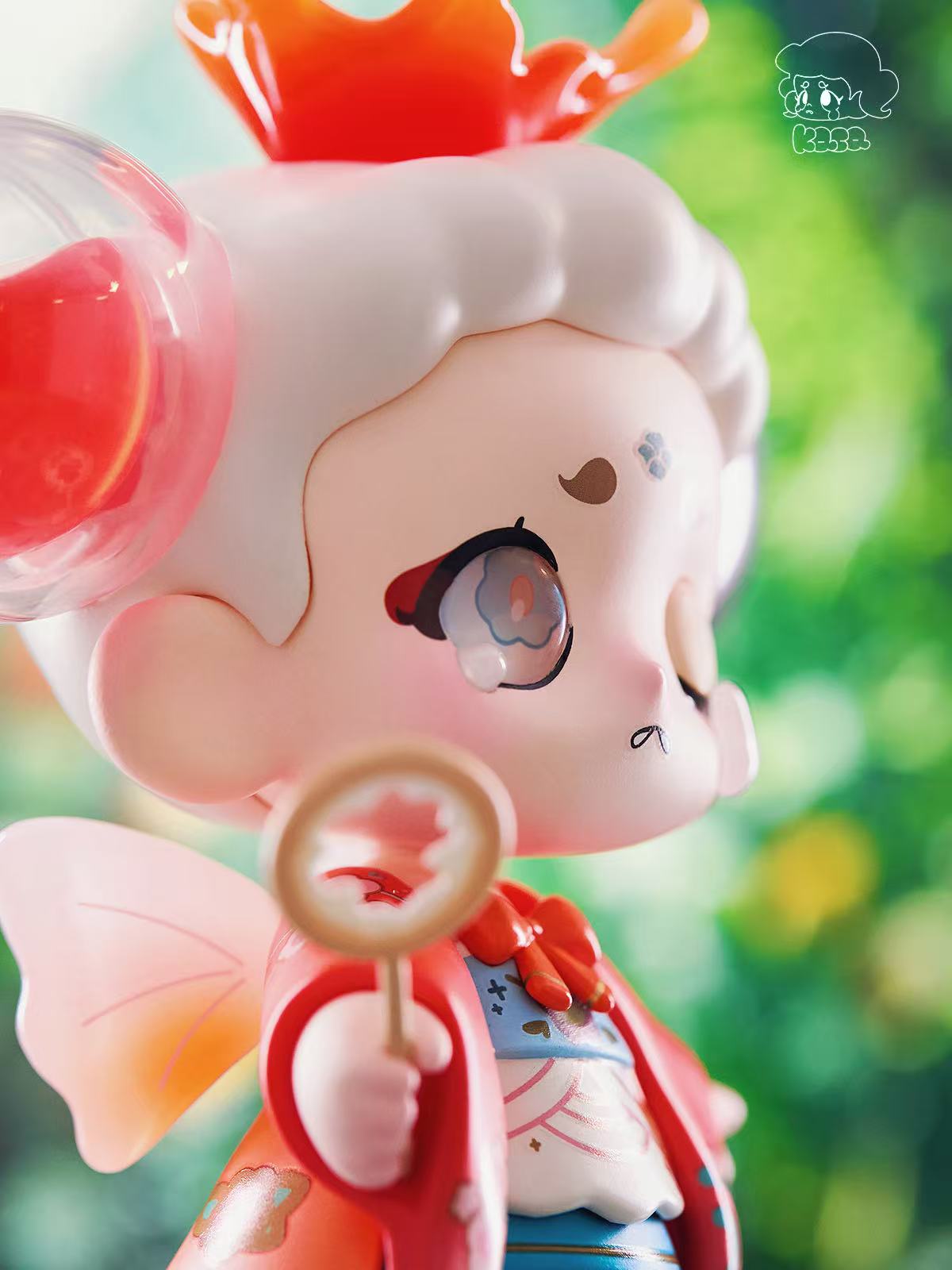 KASA 2.0 - Mystic Tales Blind Box Series figure with chibi-style face, red cloak, pink wings, and crown-like antlers, holding a mirror.