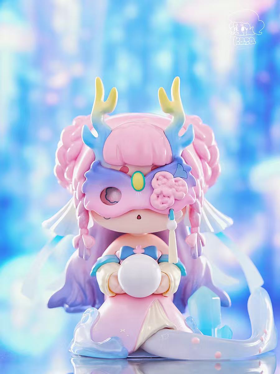 KASA 2.0 - Mystic Tales figurine: pastel pink-haired chibi with antler mask, kneeling, holding white orb; part of a fantasy-inspired blind box series.