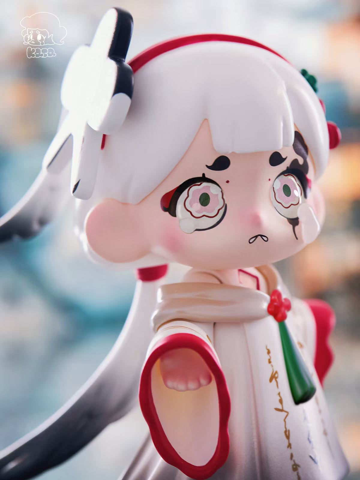 KASA 2.0 - Mystic Tales Blind Box Series figurine, featuring a chibi girl with teary eyes, white hair, and a traditional robe, embodying a whimsical, collectible art toy aesthetic.