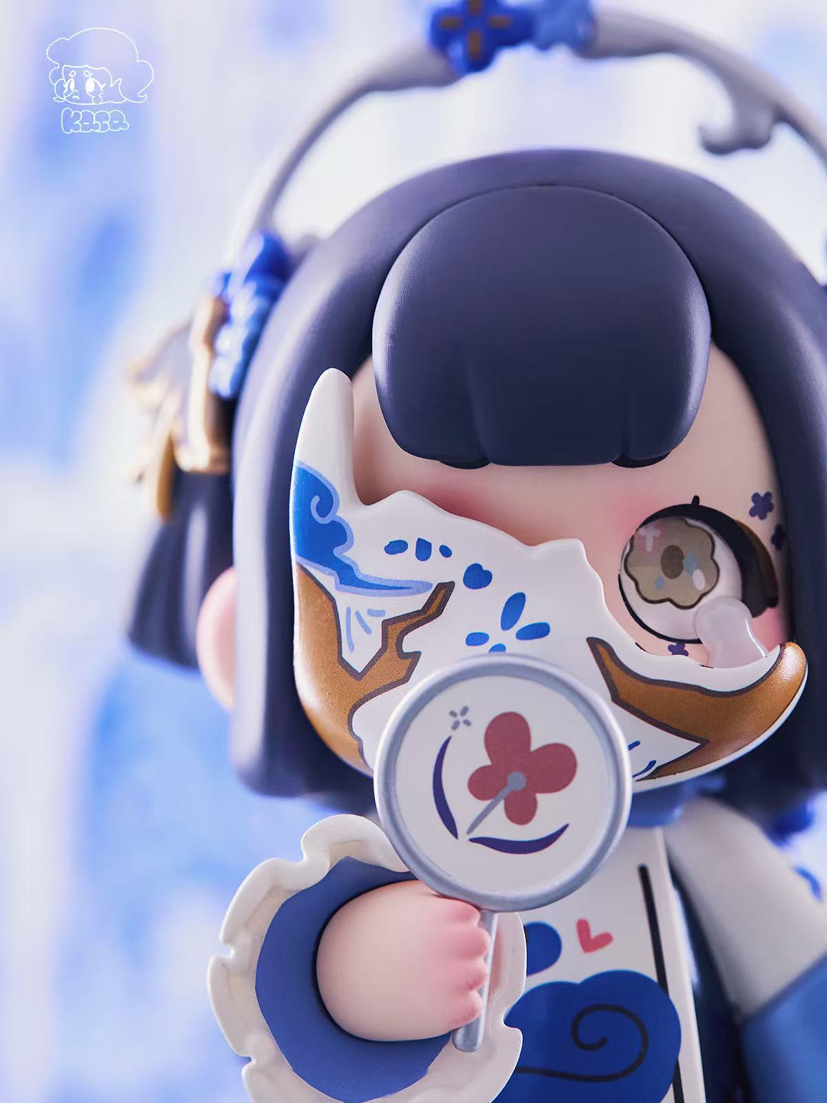 KASA 2.0 - Mystic Tales Blind Box Series: Chibi figure with navy bob-cut, porcelain mask, magnifying prop, and heart detail, showcasing whimsical East-Asian porcelain theme.