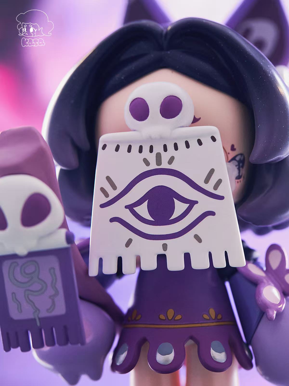 KASA 2.0 - Mystic Tales Blind Box figure: a purple-haired girl holding mystic cards with skulls, capturing a whimsical, mysterious vibe.