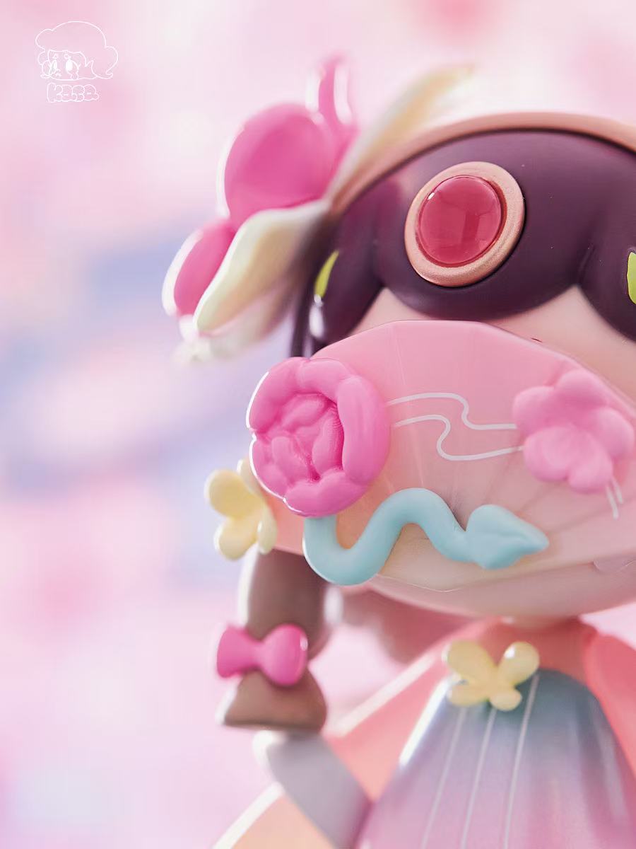 KASA 2.0 - Mystic Tales Blind Box Series vinyl toy with oversized head, glossy gem, floral mask, and braided pigtails, crafted in soft pastel tones.