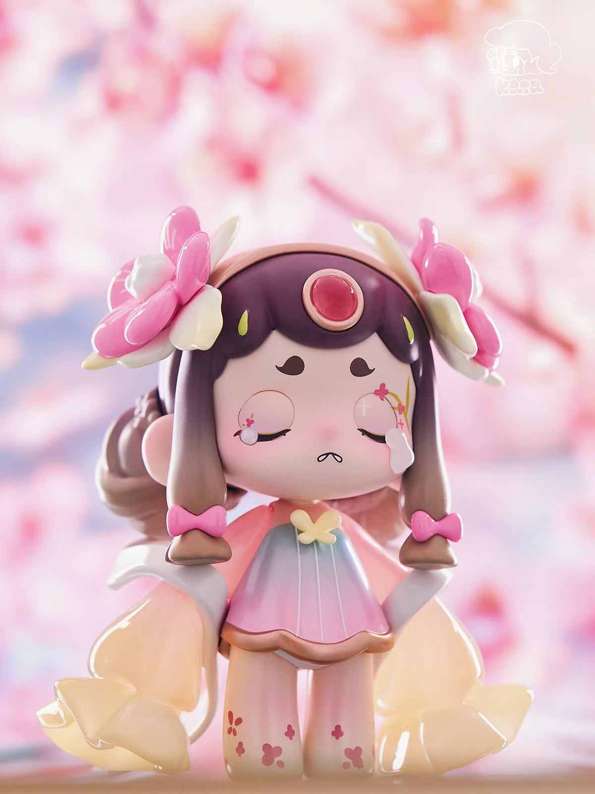 KASA 2.0 - Mystic Tales Blind Box Series figure with sakura-themed design, pastel-gradient dress, petal sleeves, flower-topped braids, and floral motifs.