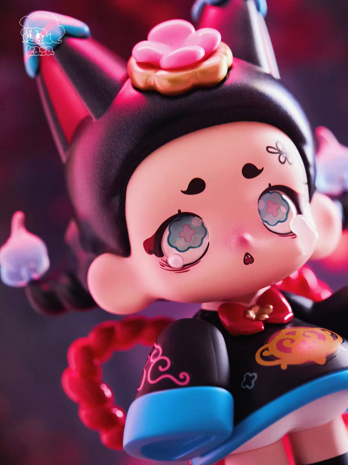 KASA 2.0 - Mystic Tales Blind Box Series: Chibi vinyl figure with cat-ear hood, floral eyes, braided pigtails, and intricate black outfit with blue accents.