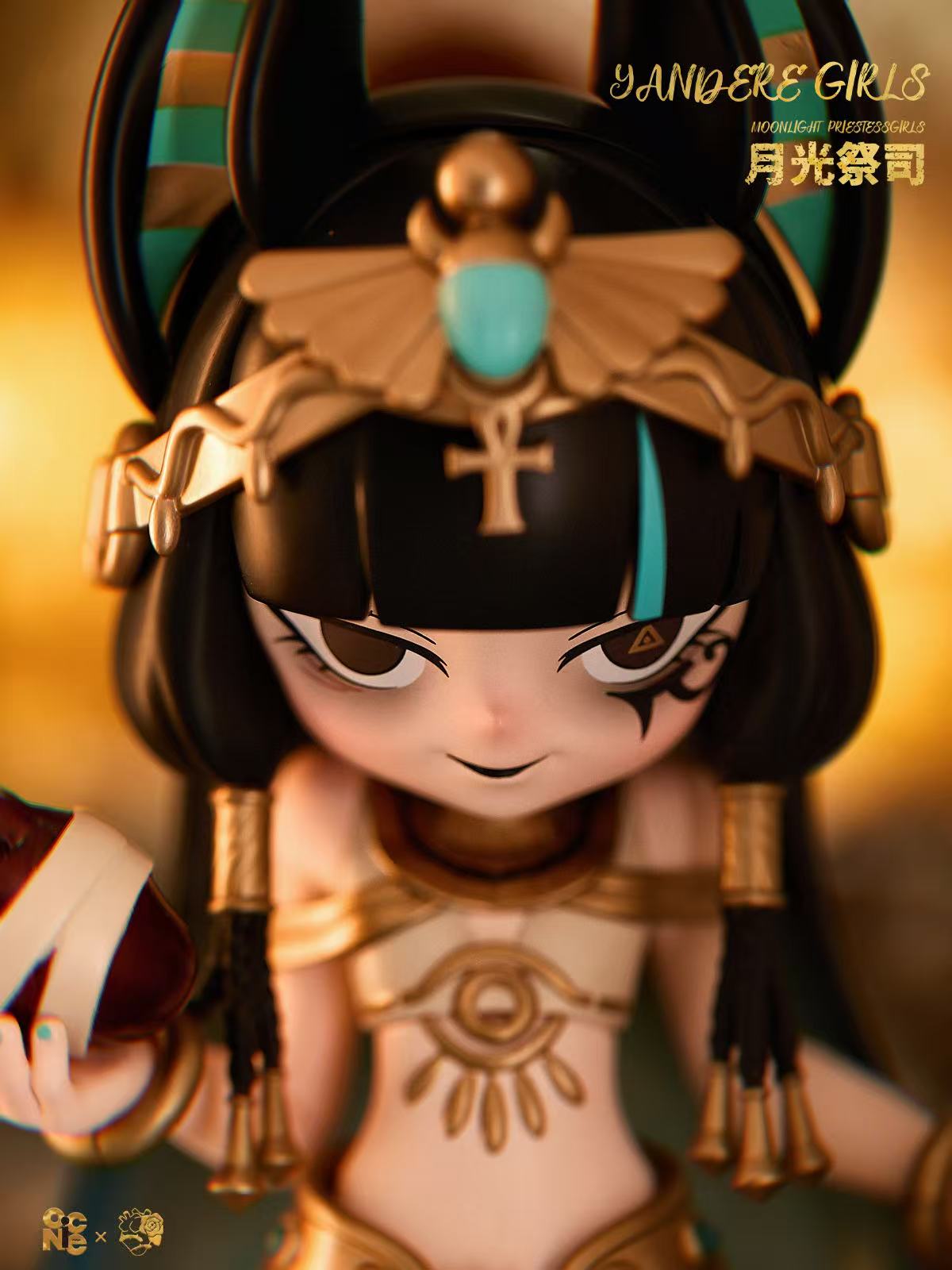 Yandere Girls The Priestess was born for the moonlight - Preorder figurine with Egyptian headdress, gold adornments, holding red gem. Part of limited edition art toy line.