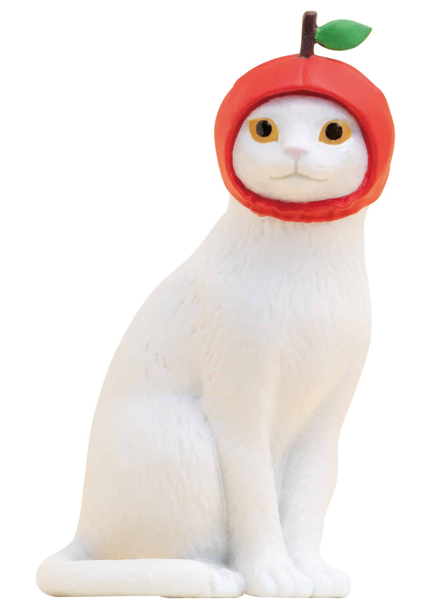A Cat Cap Figure Blind Box collectible, featuring a white cat in a red apple hat with a green leaf and brown stem.