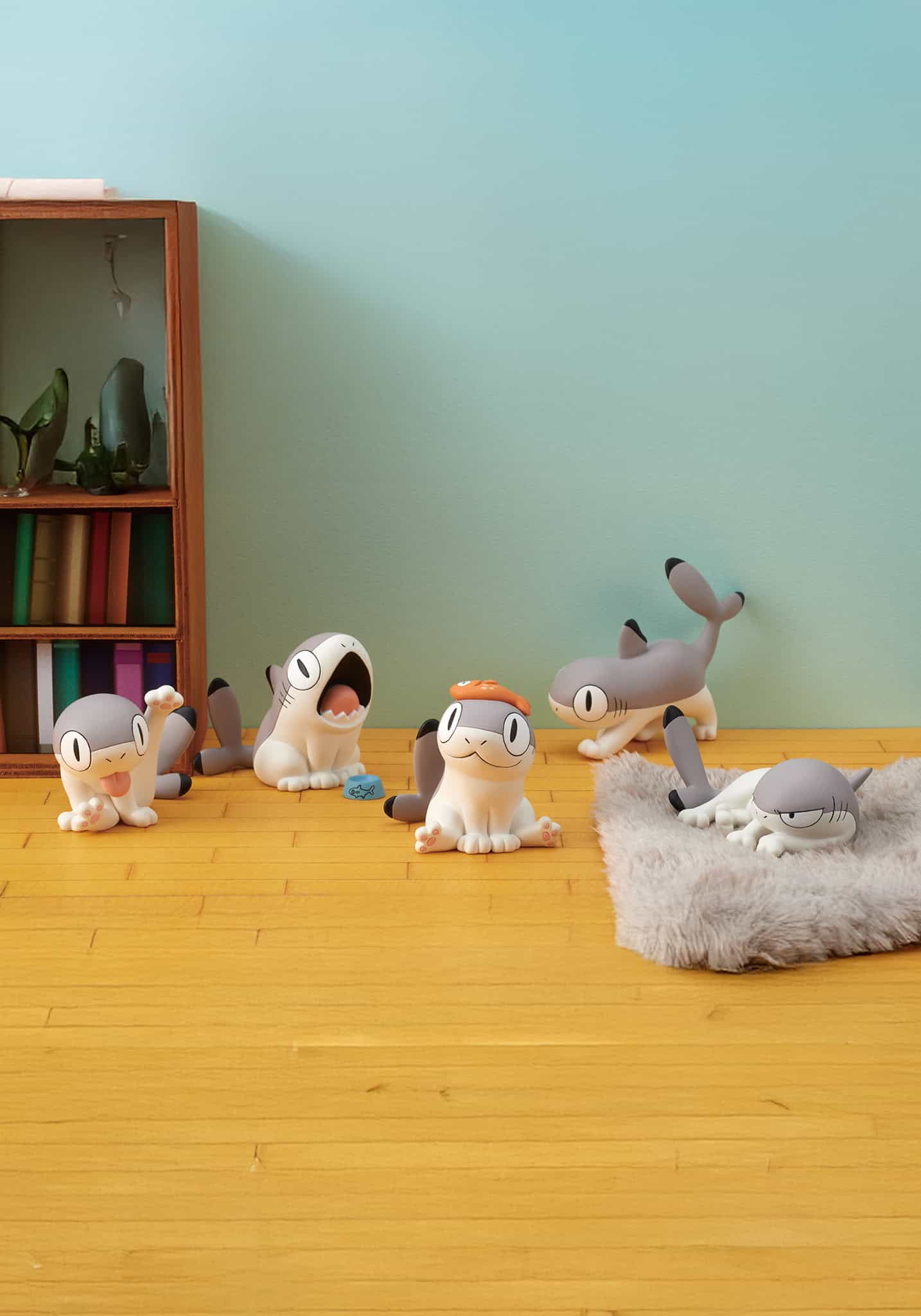 Sharkitty Blind Box diorama with five playful cat figures, each in humorous poses, showcasing the quirky feline-shark fusion on a light wood floor.