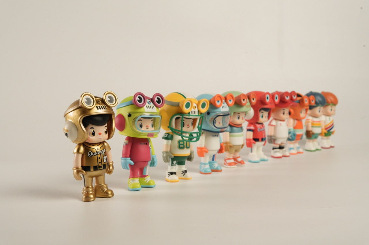 OWANGEBOY-All Stars Sports Blind Box Series featuring nine collectible toy figures with whimsical helmets and goggles, showcasing diverse styles and vibrant designs.