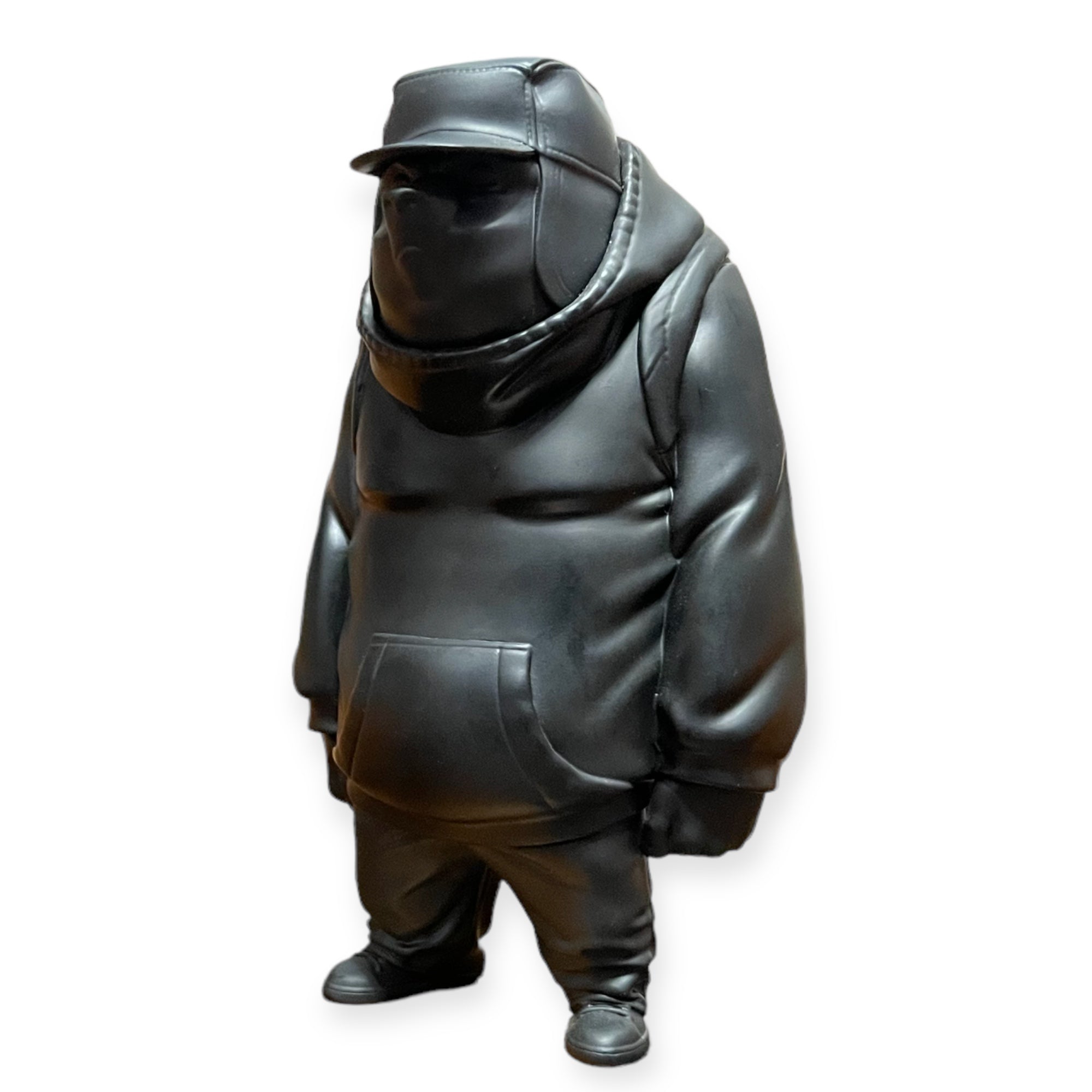 Kub Prototype by Mike Fudge, a 7 vinyl figure in a black jacket and hat, limited edition art toy by UVD Toys.