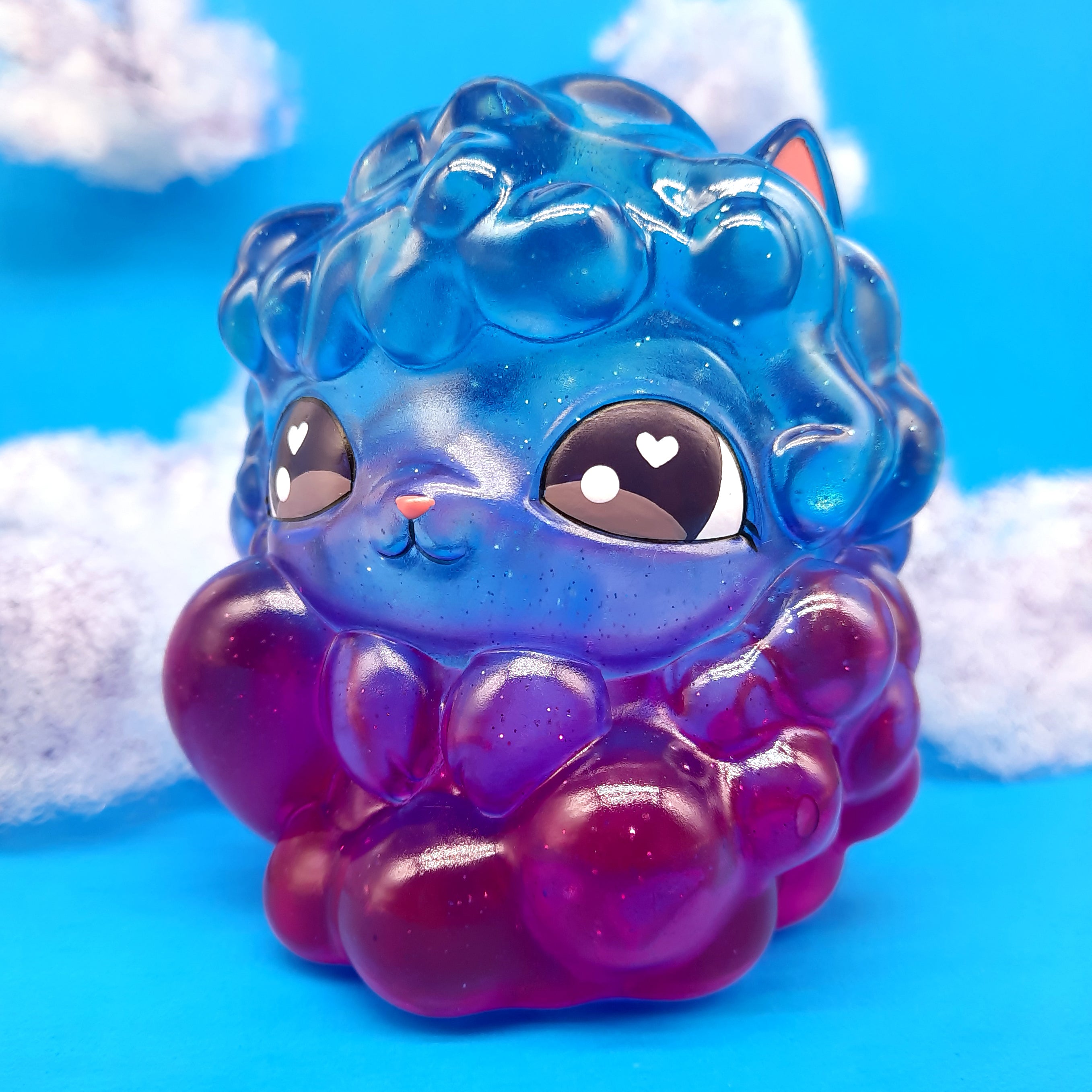 Kumo Kitty - Nightfall by The Bots, a 4-inch cloud cat toy in blue and purple, featuring a cute cartoon face and made from high-grade resin.