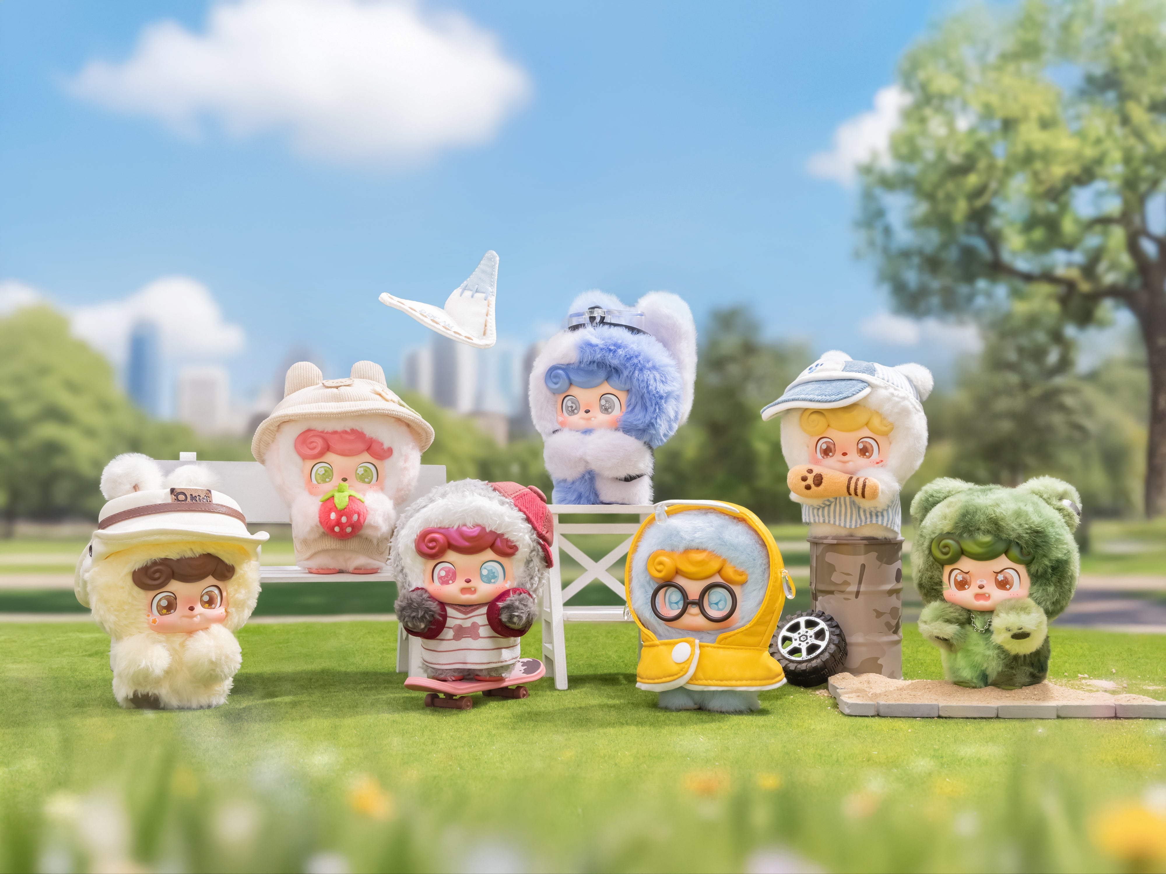 Q. Kid Outdoor Activities Series PVC Plush Blind Box features eight whimsical characters in diverse costumes on a grassy lawn, perfect for art toy enthusiasts.