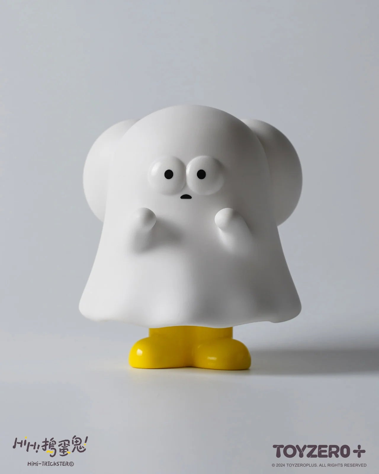 A white toy with a ghost garment and yellow boots, named HiHi Trickster - Original ver., capturing the playful essence of Strangecat Toys.