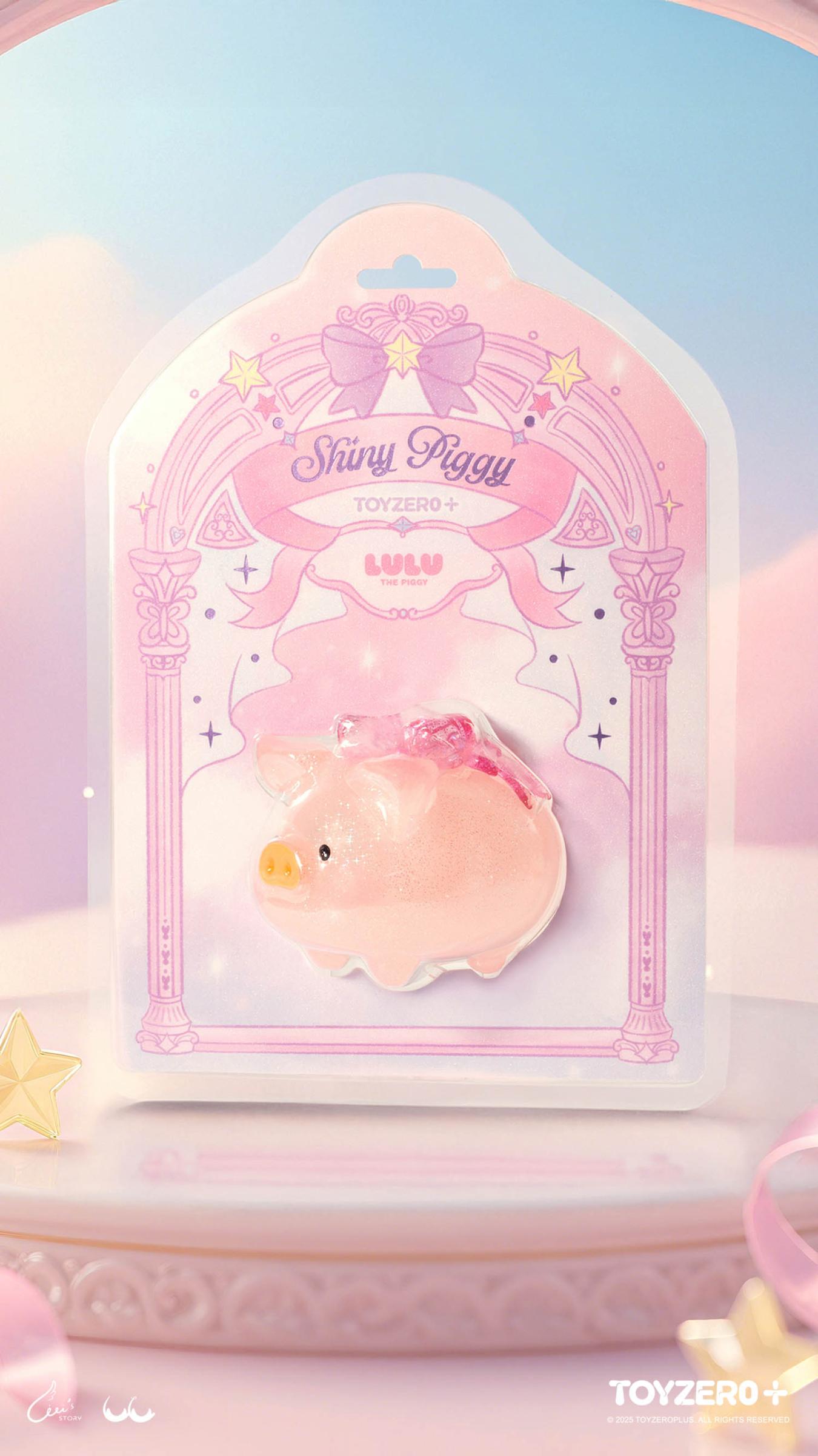LuLu the Piggy - Shiny Piggy - Preorder: Glittery pink figurine with wings in a pastel blister pack, featuring star motifs and a 3D star prop.