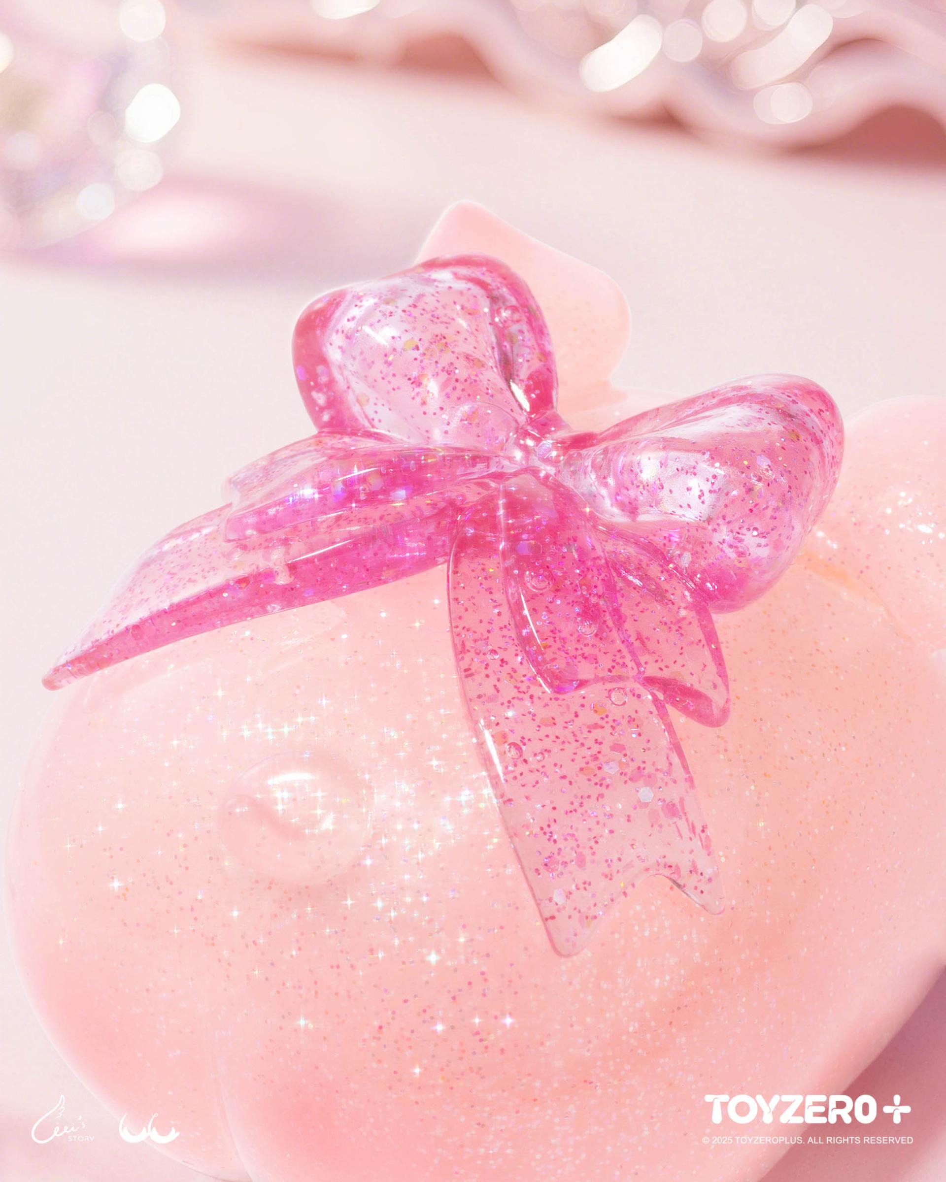 LuLu the Piggy - Shiny Piggy preorder: A pastel-pink, sparkly collectible with a glittery hot-pink bow, featuring the TOYZERO+ logo, symbolizing luck and happiness.