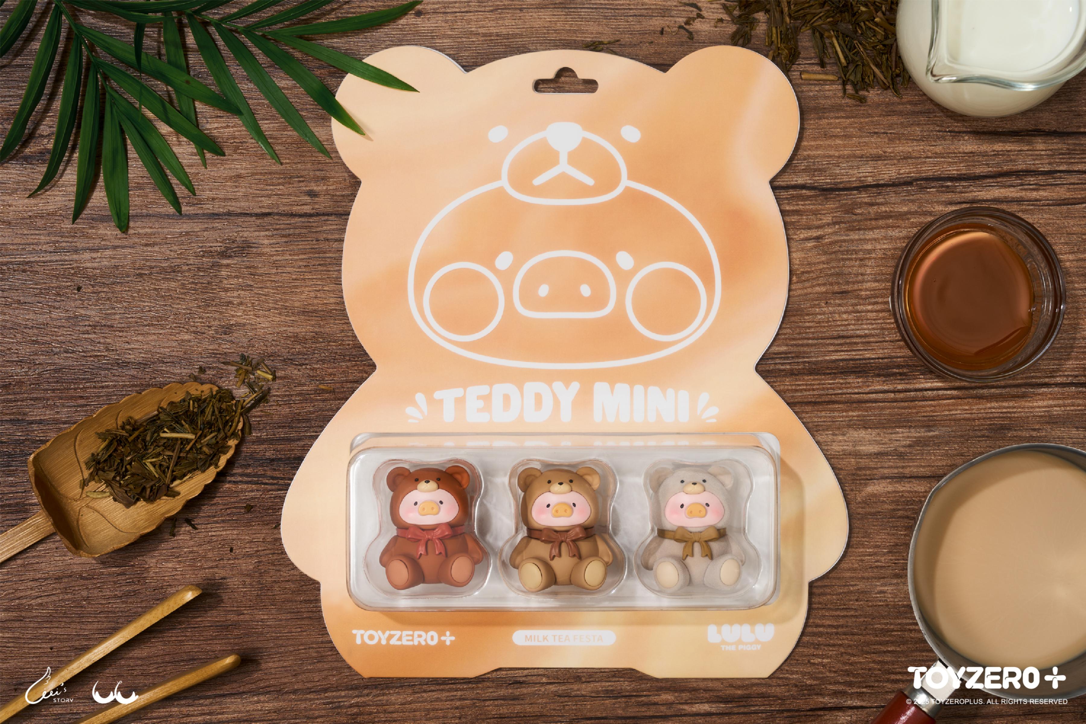 LuLu the Piggy - Teddy MINI figurines in bear outfits on a tea-themed tabletop, featuring preorder packaging from Strangecat Toys' Milk Tea Festa collection.