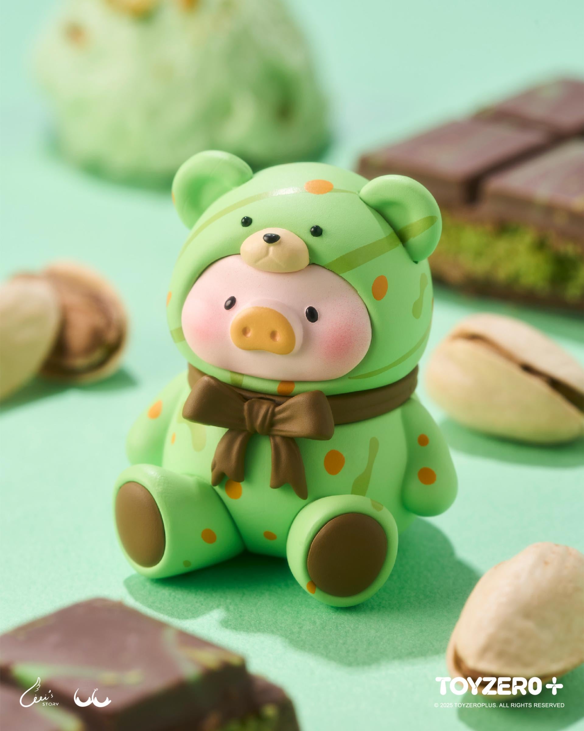LuLu the Piggy - Teddy MINI Limited Edition (Summer Chill) vinyl figure in a bear suit on a mint-green surface with pistachio nuts and dark-green chocolate.