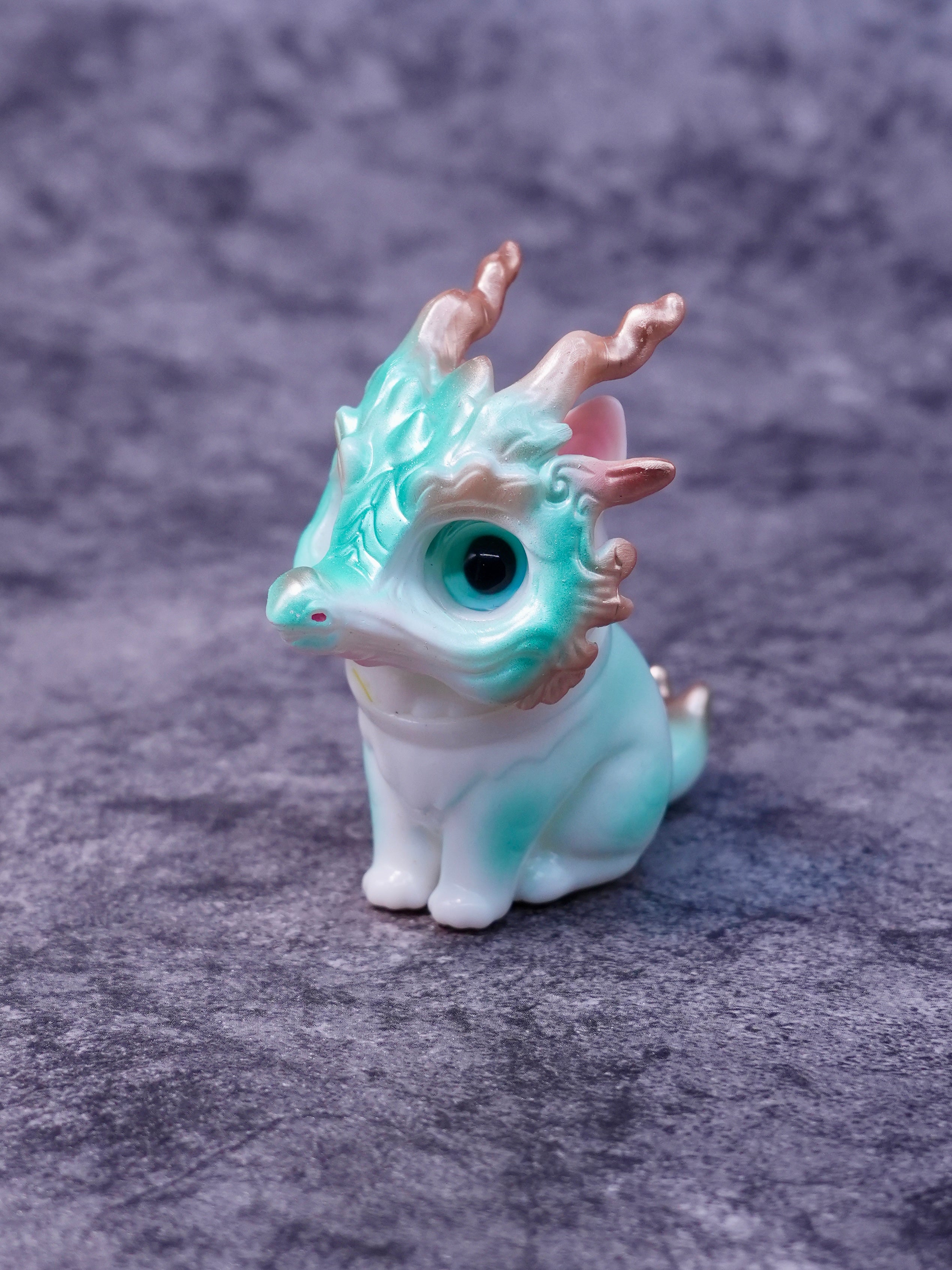 Little Azure Loong figurine by HOTRU, featuring a chibi-style dragon-cat fusion with gold accents, rotatable head, and detachable resin mask, on a stone-textured surface.