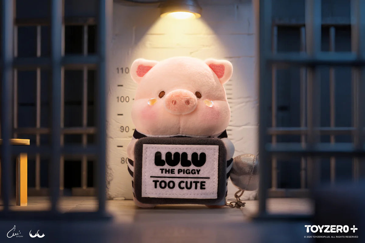 LuLu the Piggy LuLuLand - Too Cute to Jail Prisoner Lu Plush Keychain depicted as a plush pig in a mock jail with a placard and ball-and-chain.