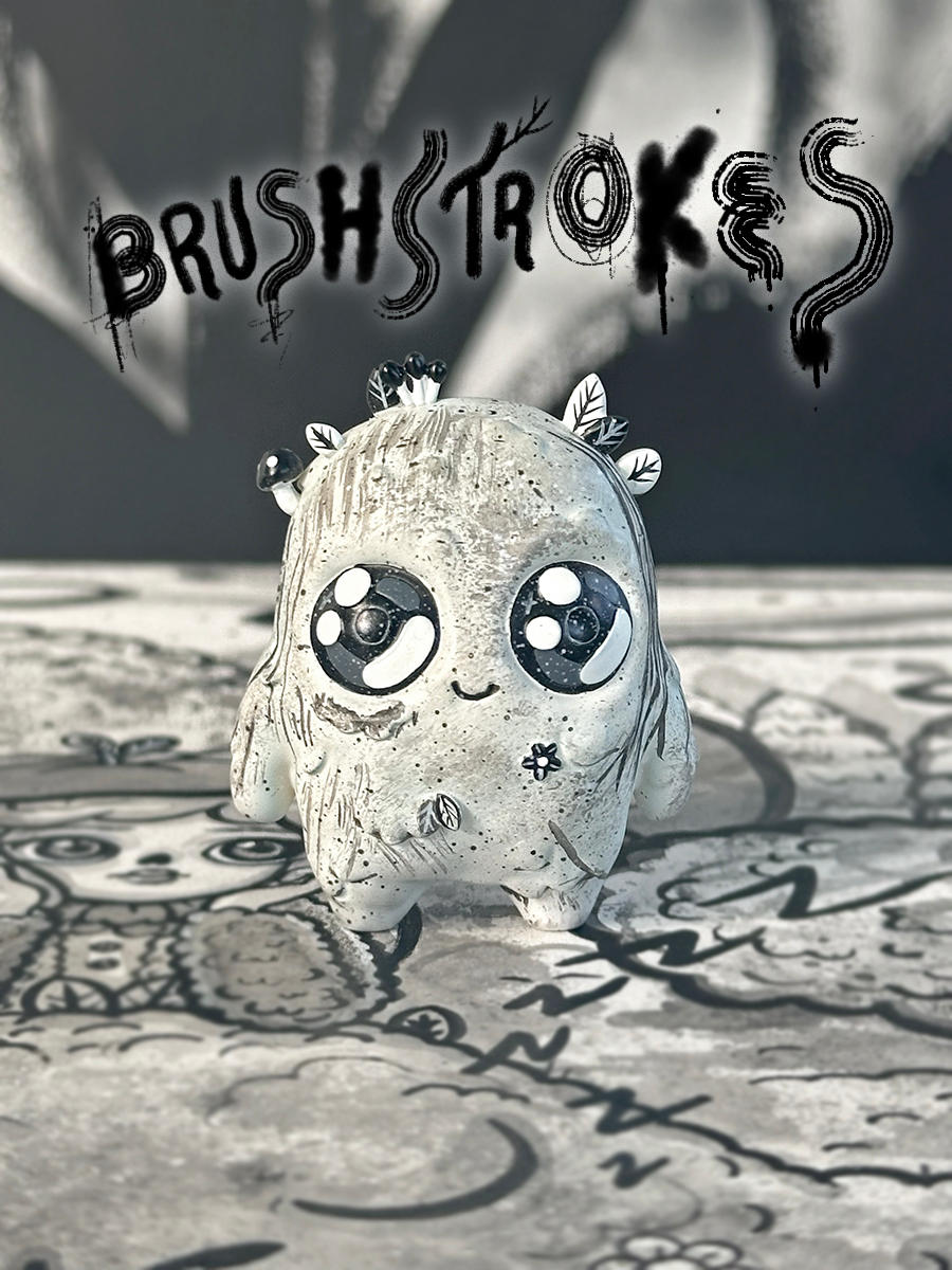 Mossy - The Mini Moss Spirit, a small resin toy with a black and white face, limited to 75 pieces, featuring unique brushstrokes by Mumbot.