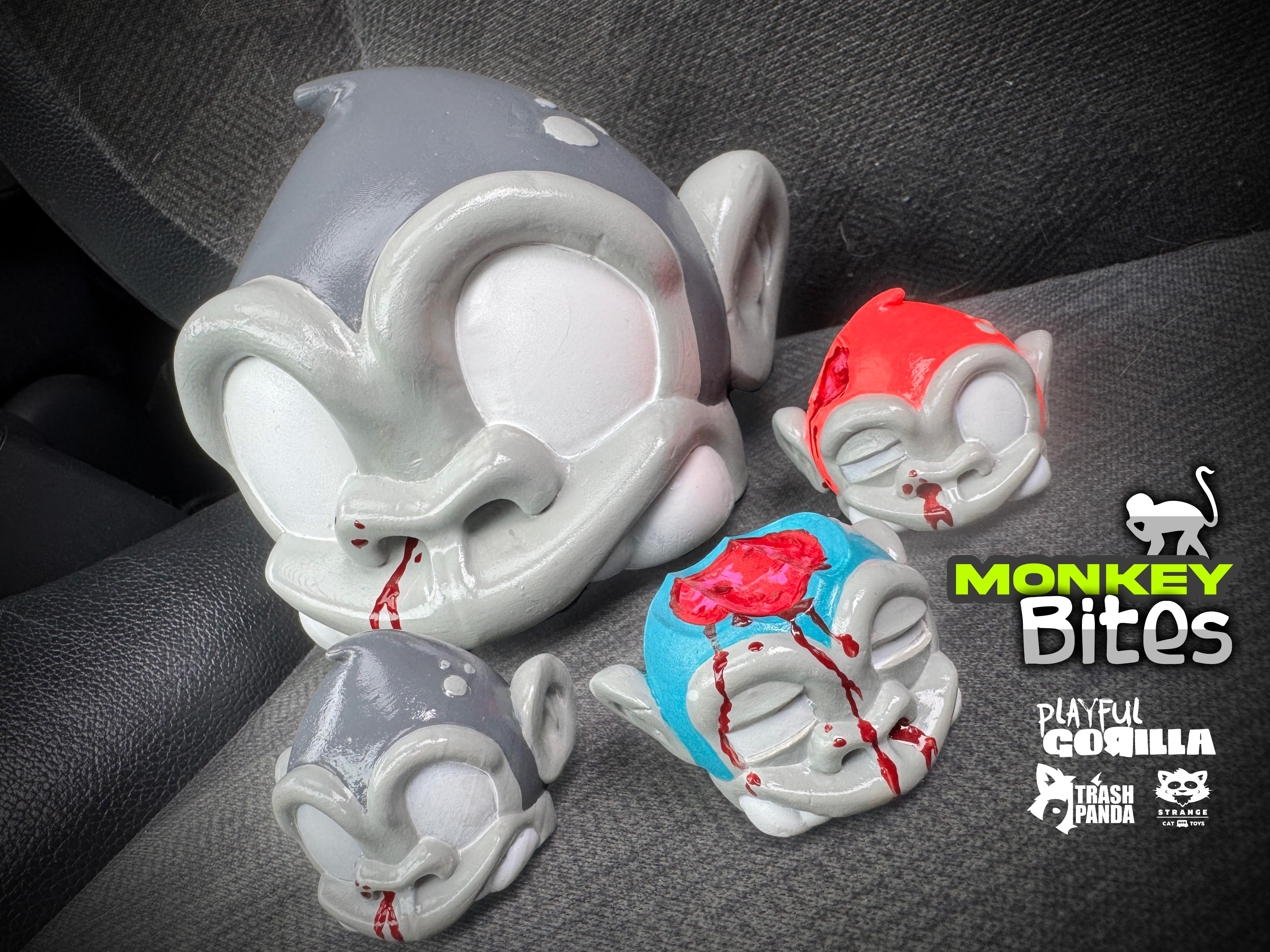 Bite Me - MonkeyBites by Playful Gorilla: A set of 3D printed resin figurines, depicting cartoon characters, displayed on a couch.