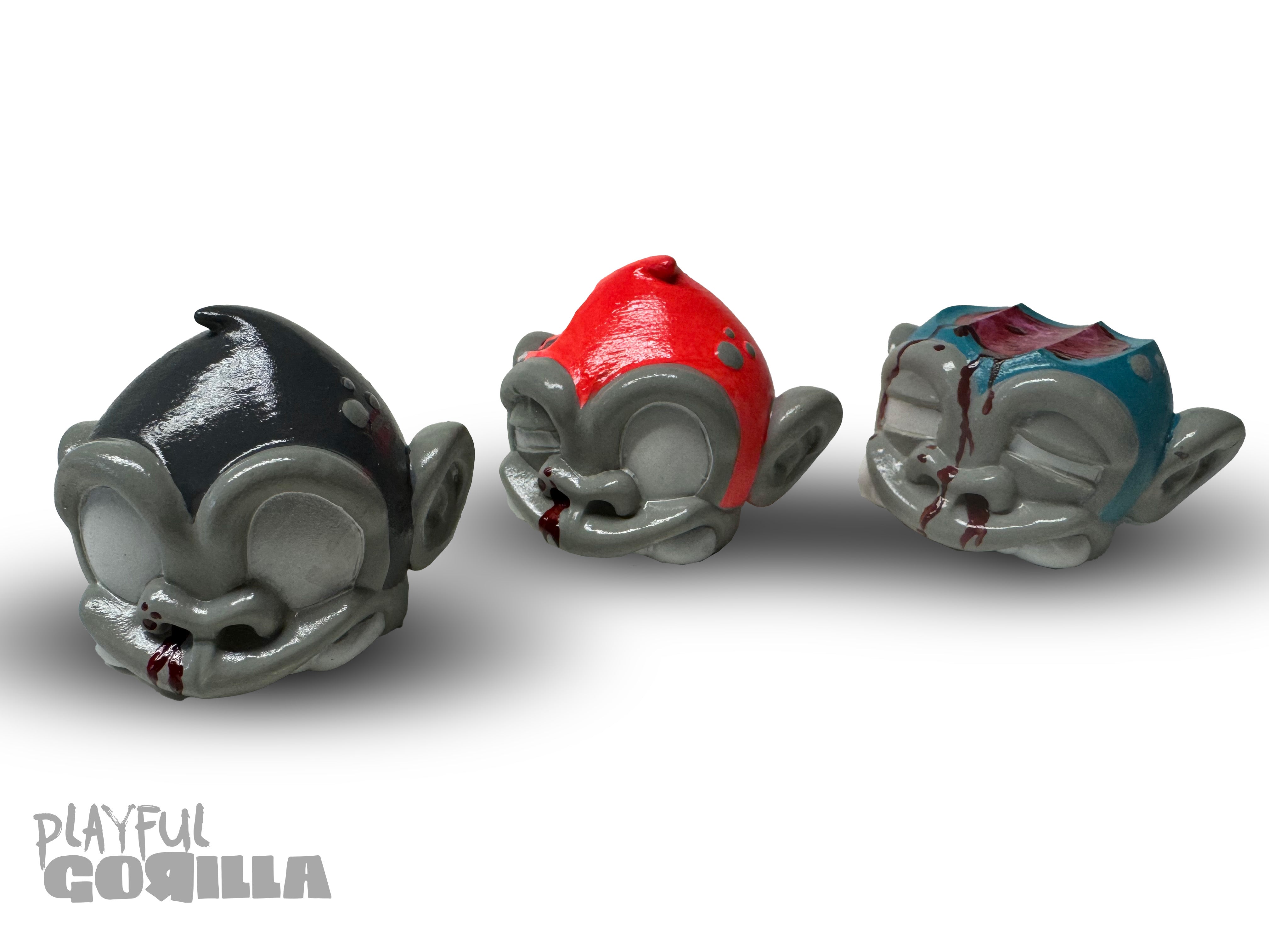 Bite Me - MonkeyBites by Playful Gorilla: A set of 3D printed resin monkey figurines, creatively painted, showcasing quirky, artistic designs from Strangecat Toys.