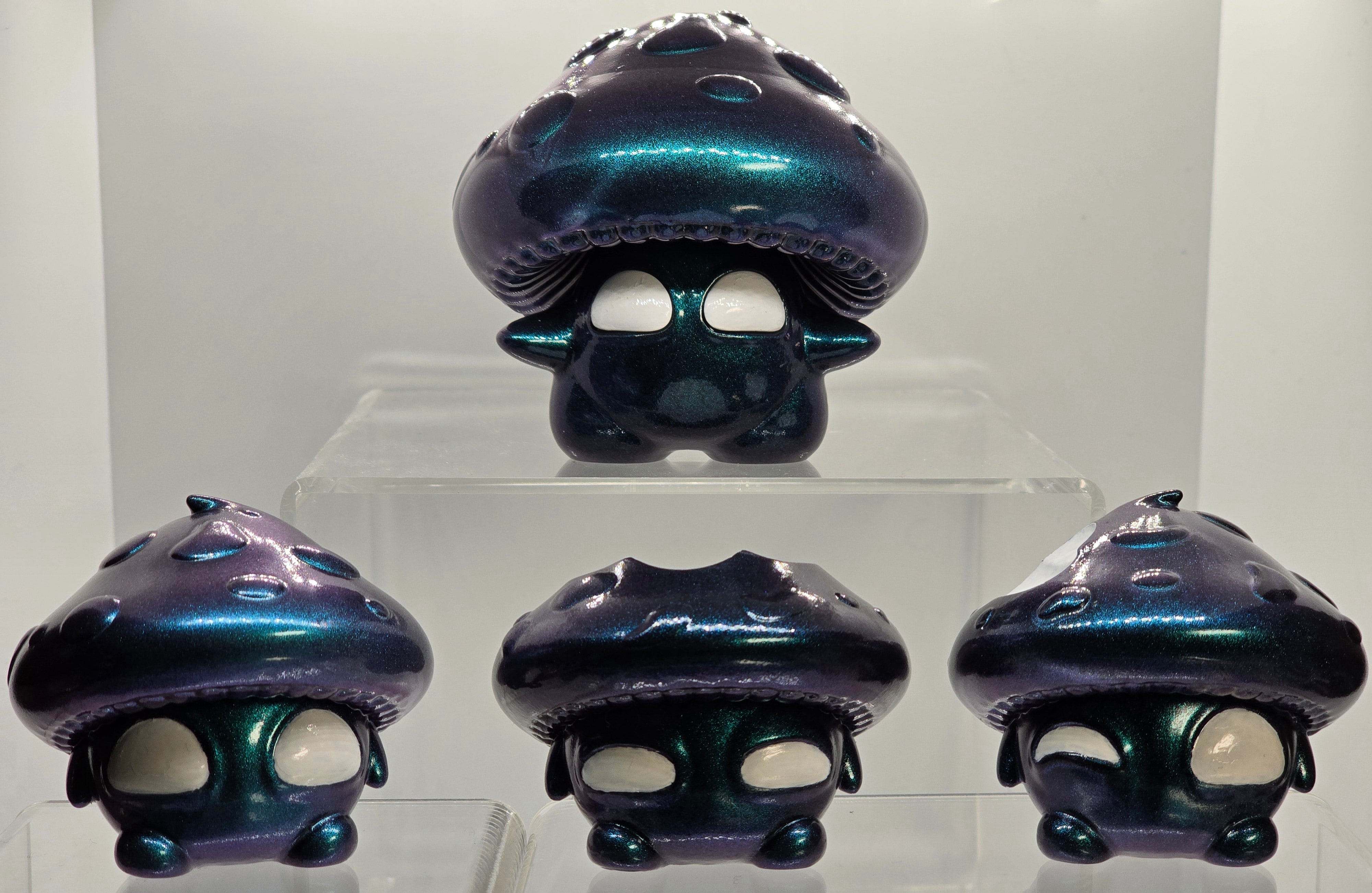 Bite Me - Bites by Neff's Nexus: Shiny epoxy resin toy featuring a mushroom design with eyes and mouth, part of Strangecat Toys' unique art toy collection.