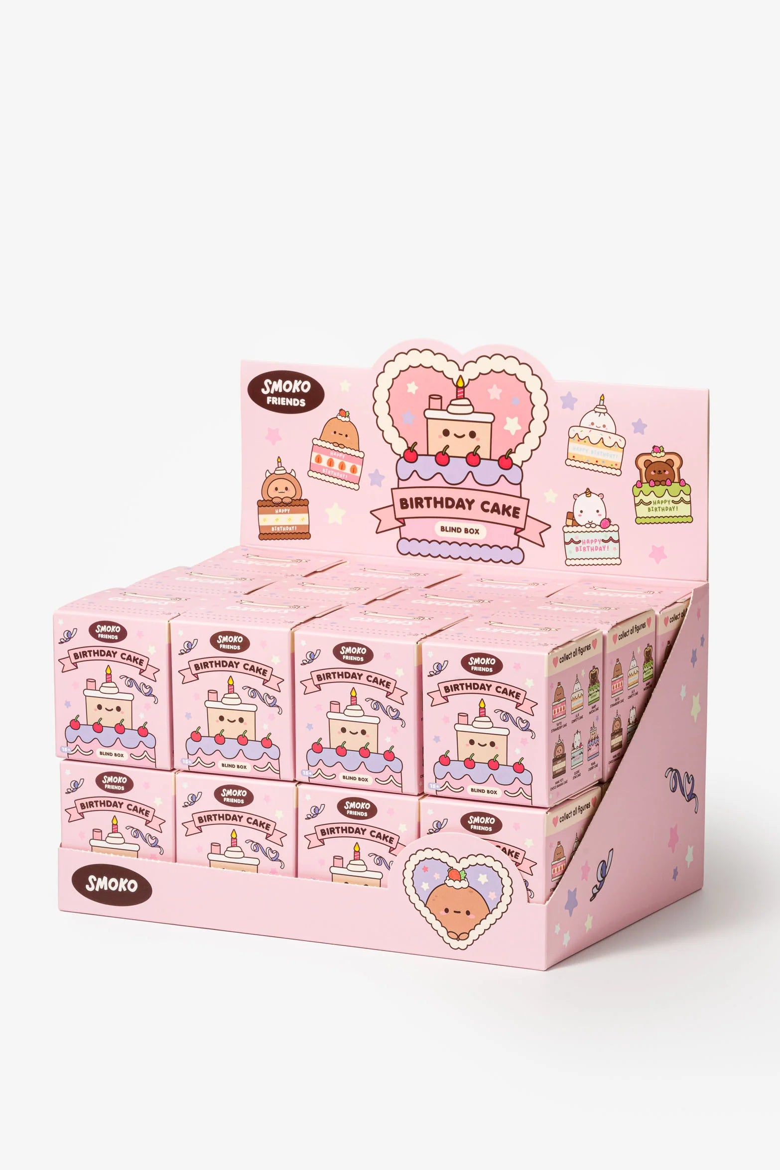 Retail display of Smoko Friends Birthday Cake Blind Box Figures, featuring pastel-pink cartons with kawaii cake characters, each box containing one surprise vinyl figure.