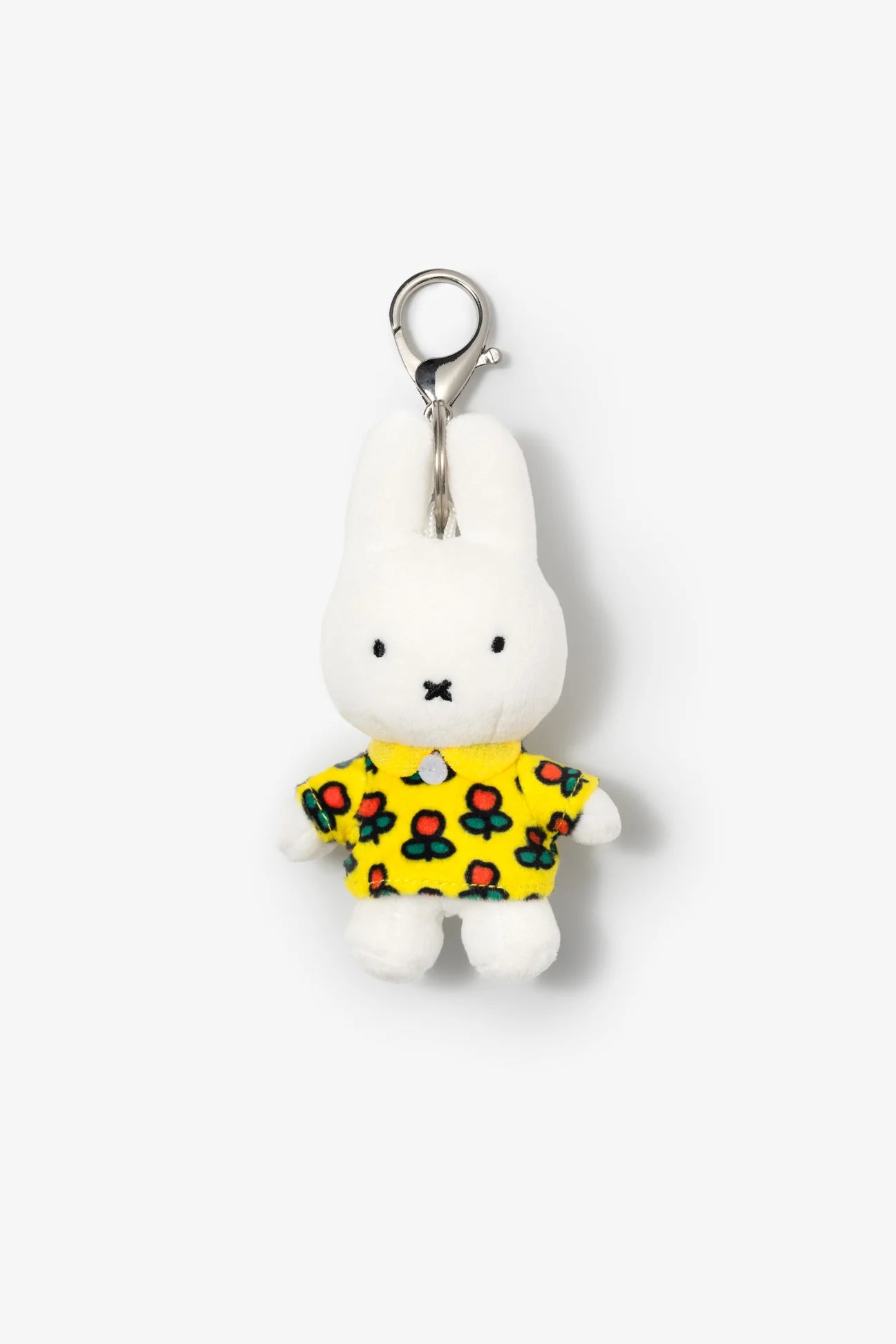 Smoko Miffy Tulip Bag Charm: A white rabbit plush keychain wearing a floral yellow shirt with a metal clasp for easy attachment.