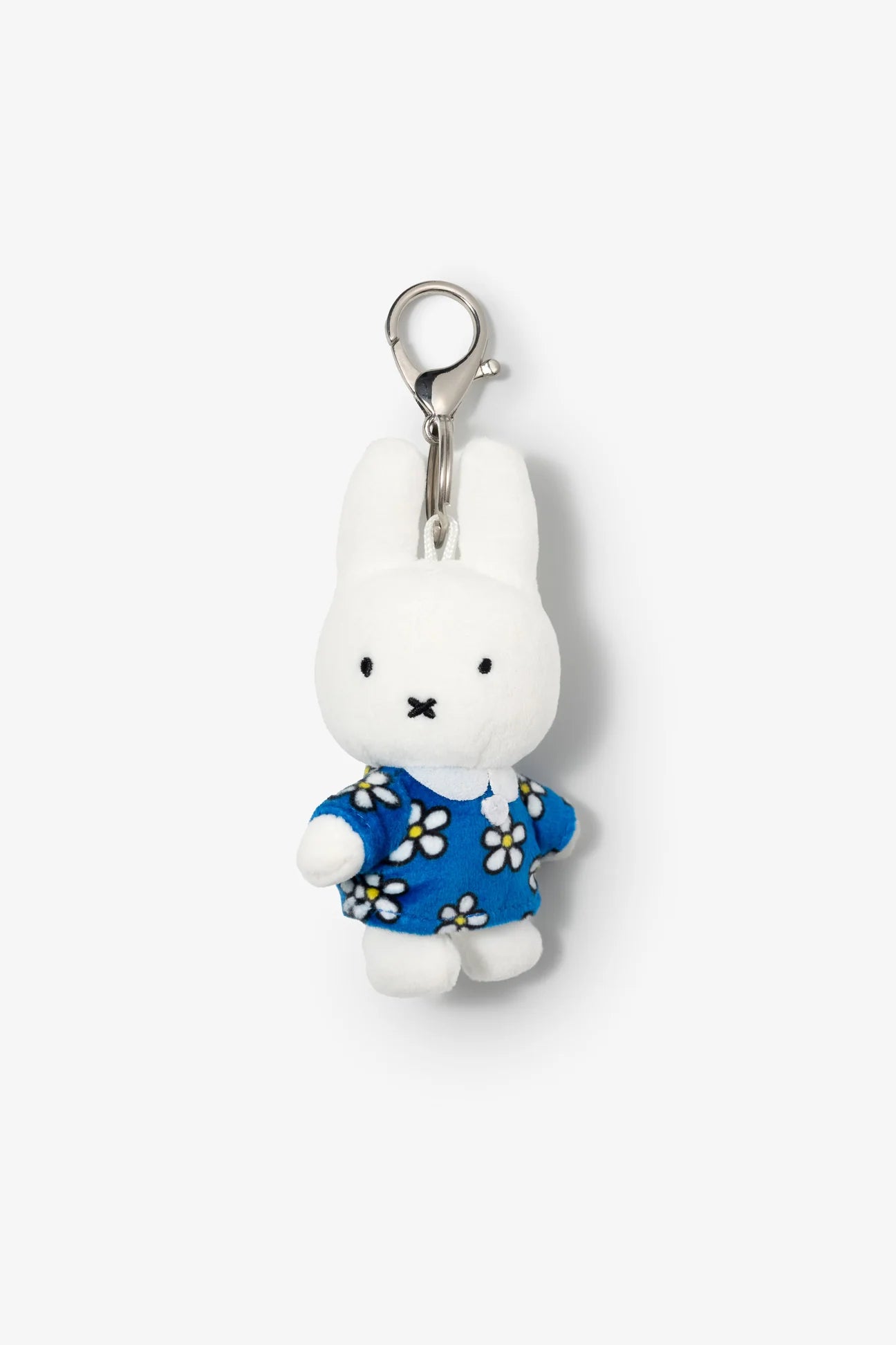 Smoko Miffy Blue Daisy Bag Charm: A small white bunny plush keychain in a blue daisy-patterned shirt, featuring a minimalist face, with metal clasp for attachment.