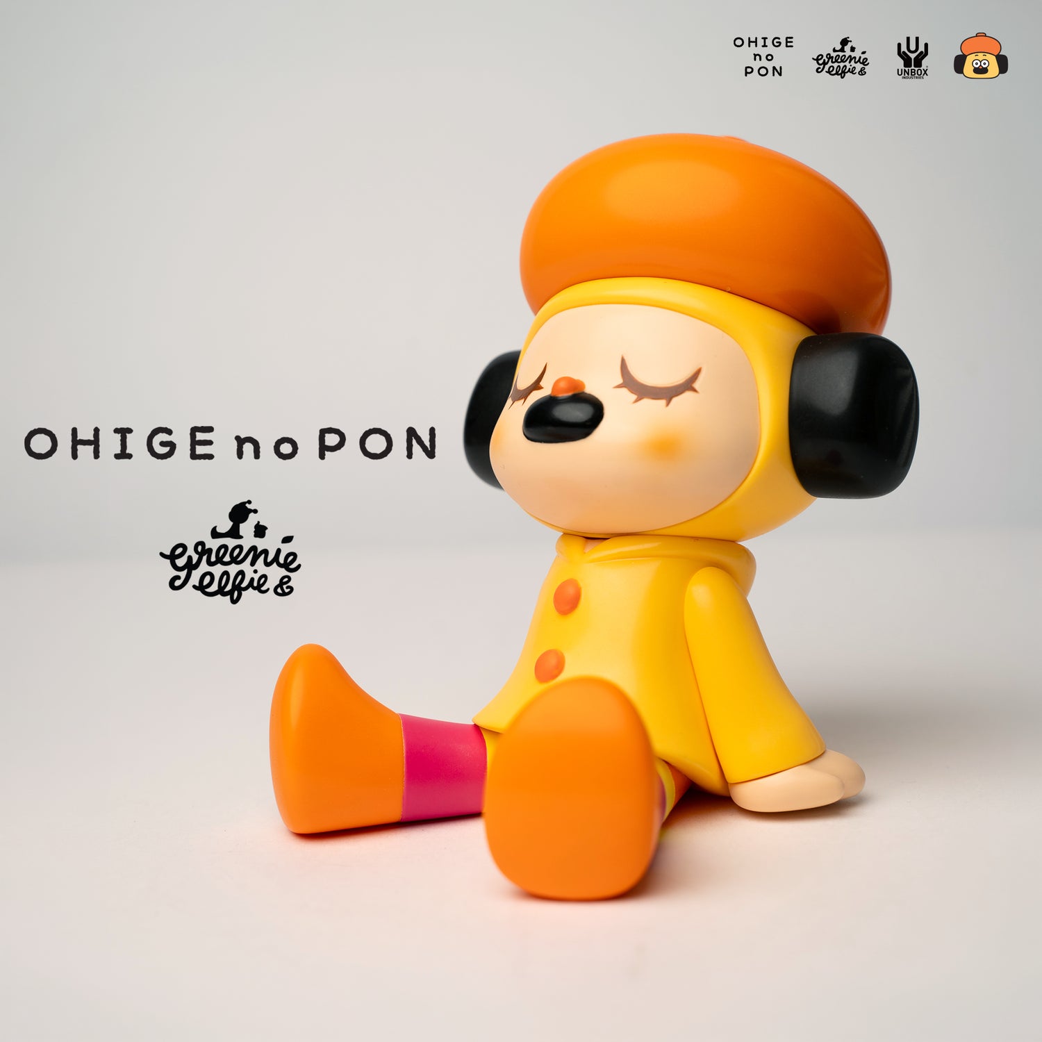 GREENIE OHIGEnoPON Edition preorder: a small vinyl art toy with a beret, yellow coat, orange boots, and closed eyes, designed by Too Natthapong.