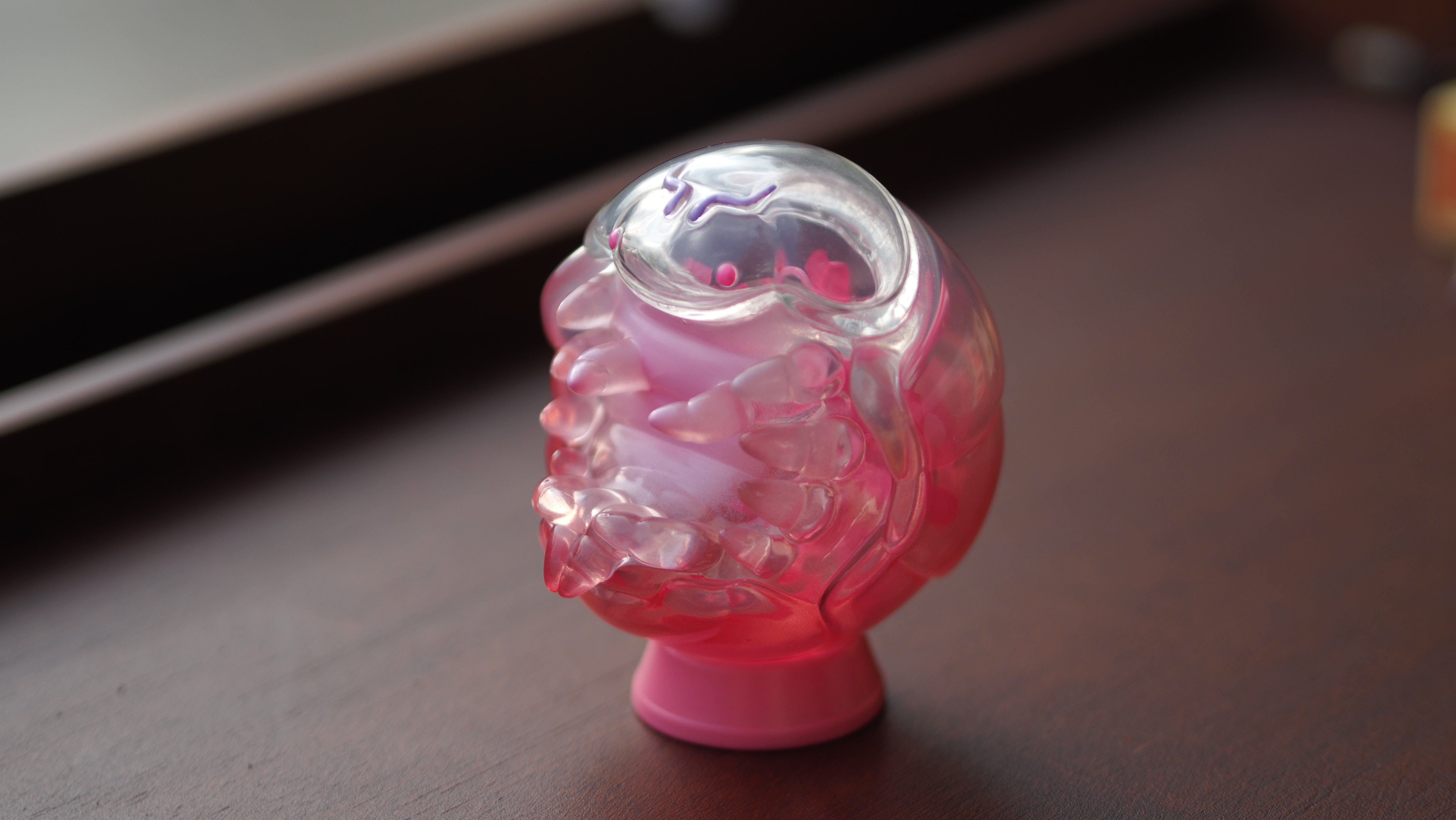 A close-up of Sakura Bobo, a 10 cm tall soft vinyl toy in pink and clear plastic. Preorder - Ships Late May 2024.