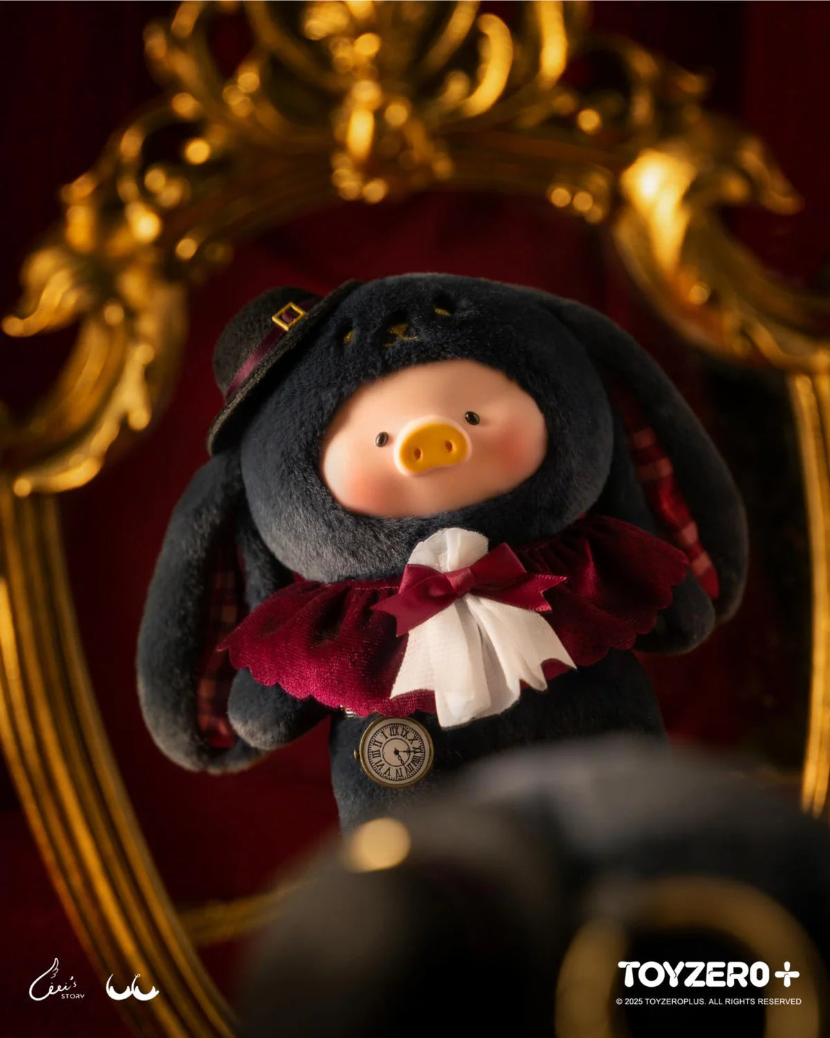 LuLu the Piggy keychain, dressed as Magician Bunny Lu, in a black rabbit suit, red cape, and pocket-watch, set in a decorative mirror frame.