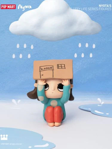 Nyota's Fluffy Life Blind Box Series - Preorder: Cartoon figurine holding a cardboard sign. Purchase includes 12 regular designs or 11 regular and 1 secret. Ships July 2024.