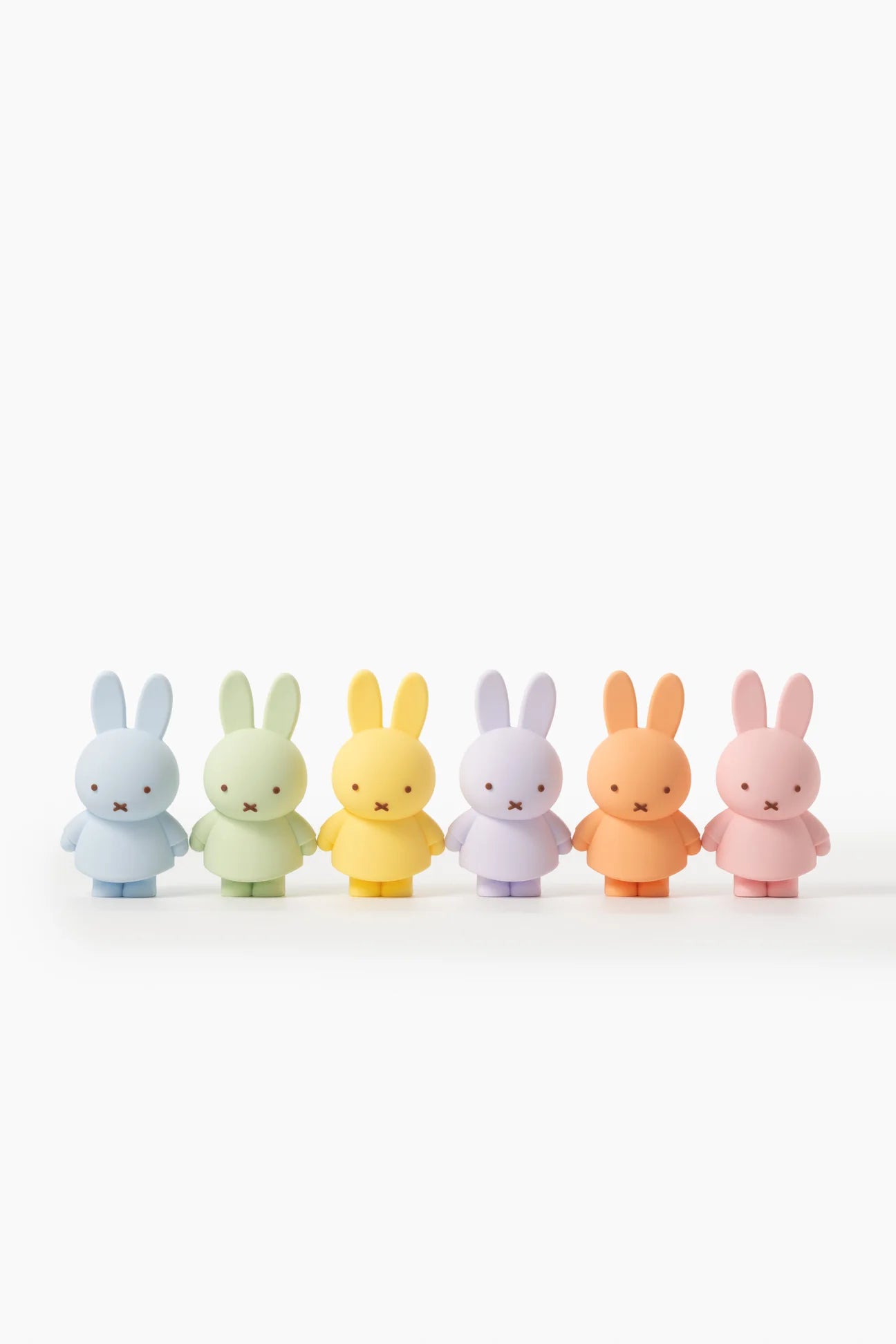Smoko Miffy Goes Pastel Blind Box Figures: six small pastel-colored rabbit figures, collectible vinyl toys, each with simple features, reflecting the playful charm of Strangecat Toys.