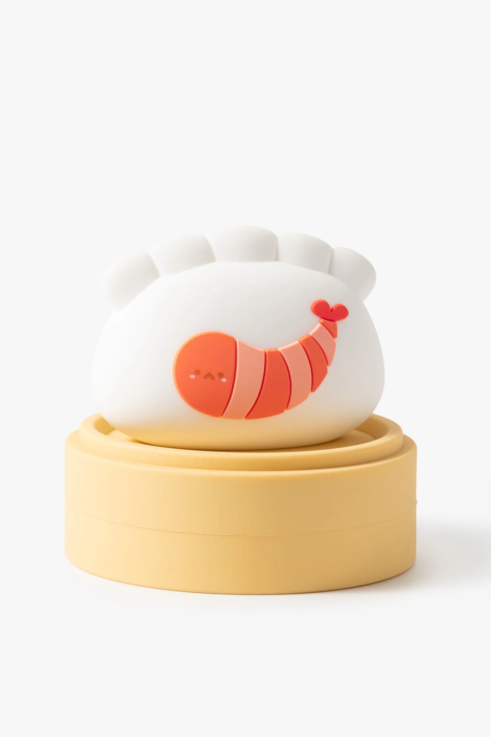 Smoko Dim Sum Friends Blind Box Figure featuring a white dumpling with a cartoon shrimp design, sitting on a mustard-yellow base, collectible toy for ages 15+.