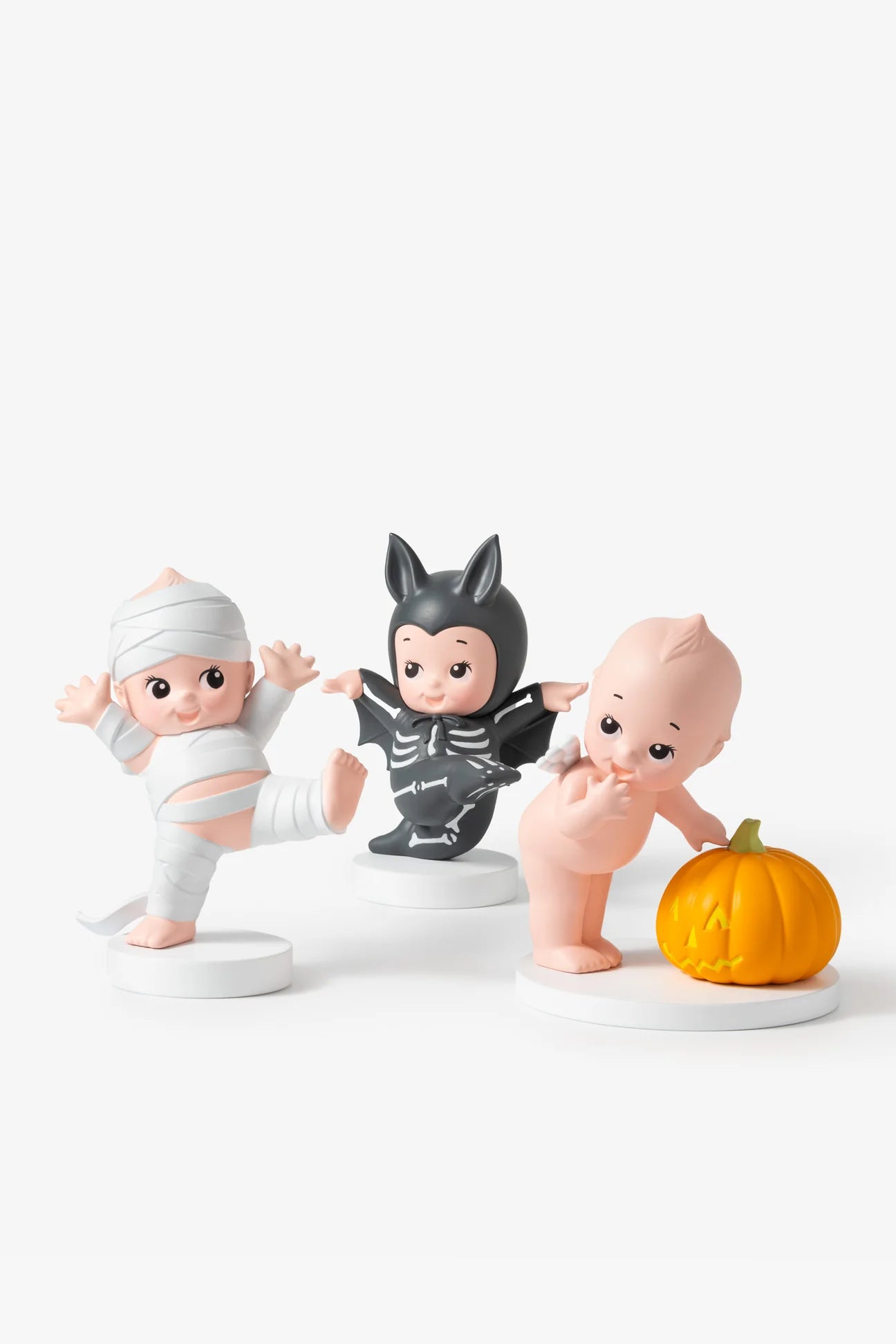 Smoko Kewpie Halloween Blind Box Figures with mummy, bat, and jack-o'-lantern designs, showcasing collectible Kewpie dolls in Halloween-themed costumes.