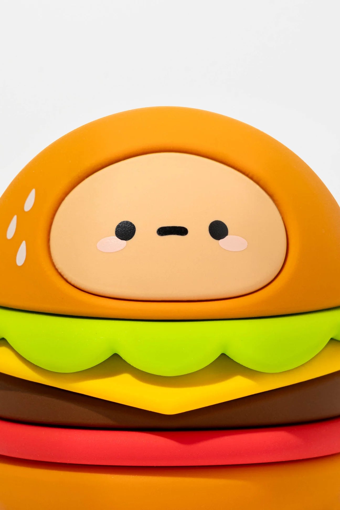 Tayto's Diner Blind Box Figure: a cute, kawaii-style hamburger toy with a face, part of a collectible vinyl series including hot dog, shake, and more.