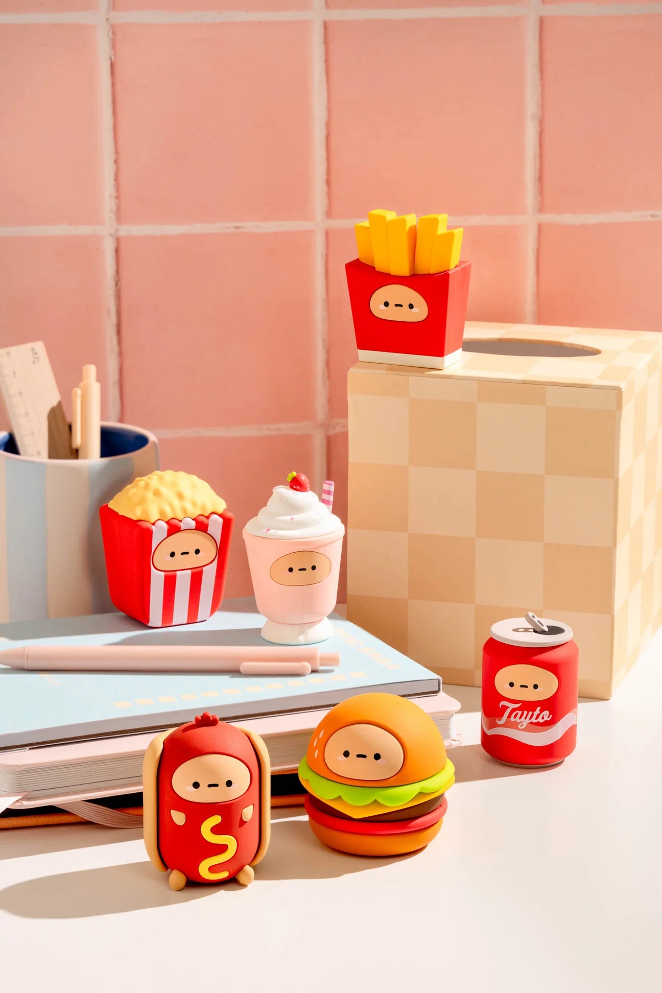 Tayto's Diner Blind Box Figure set featuring cartoonish fast-food characters: popcorn, milkshake, fries, hot dog, cheeseburger, and a soda can on a desk.
